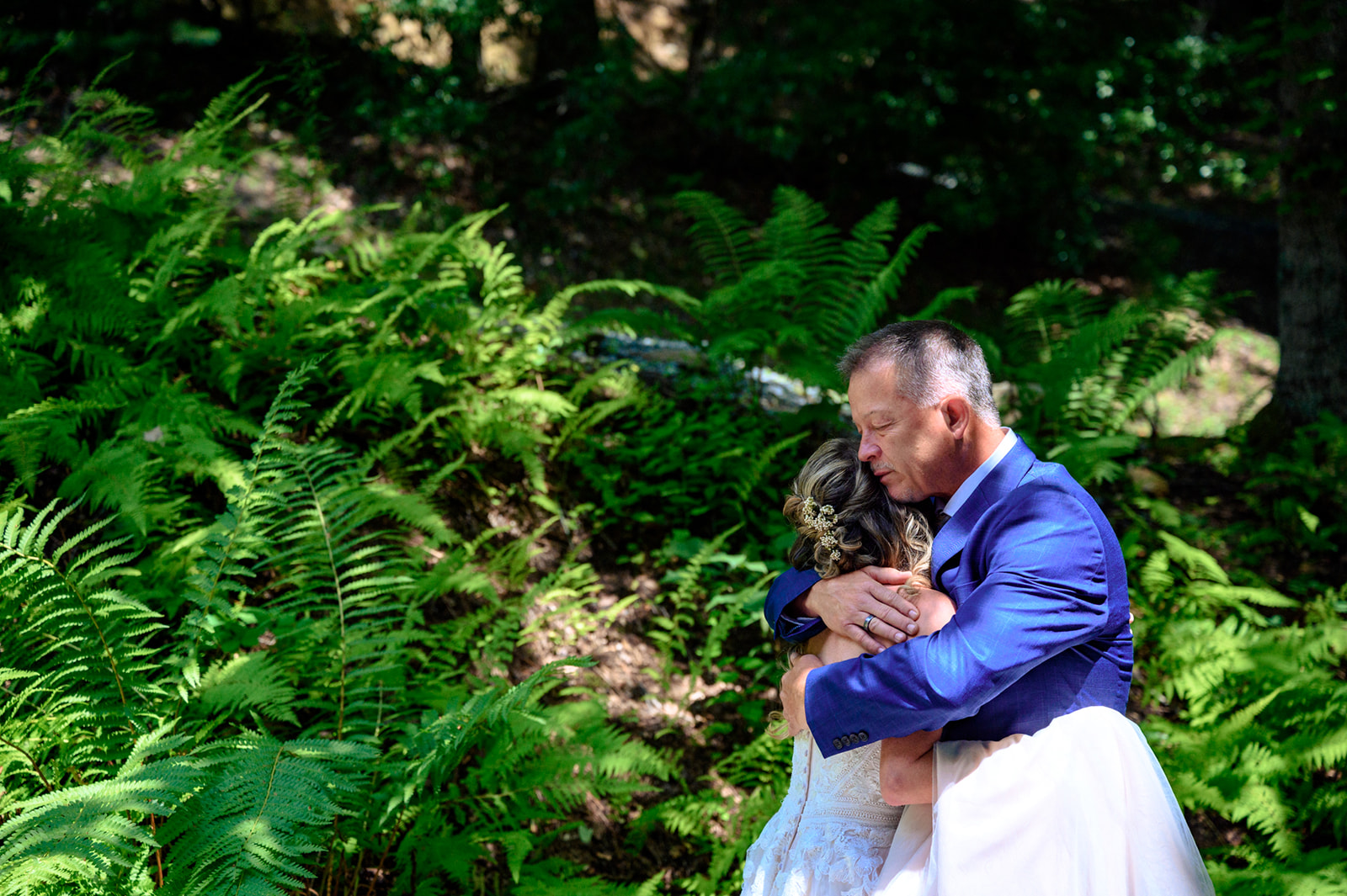bride shares first look with father at nantahala weddings event