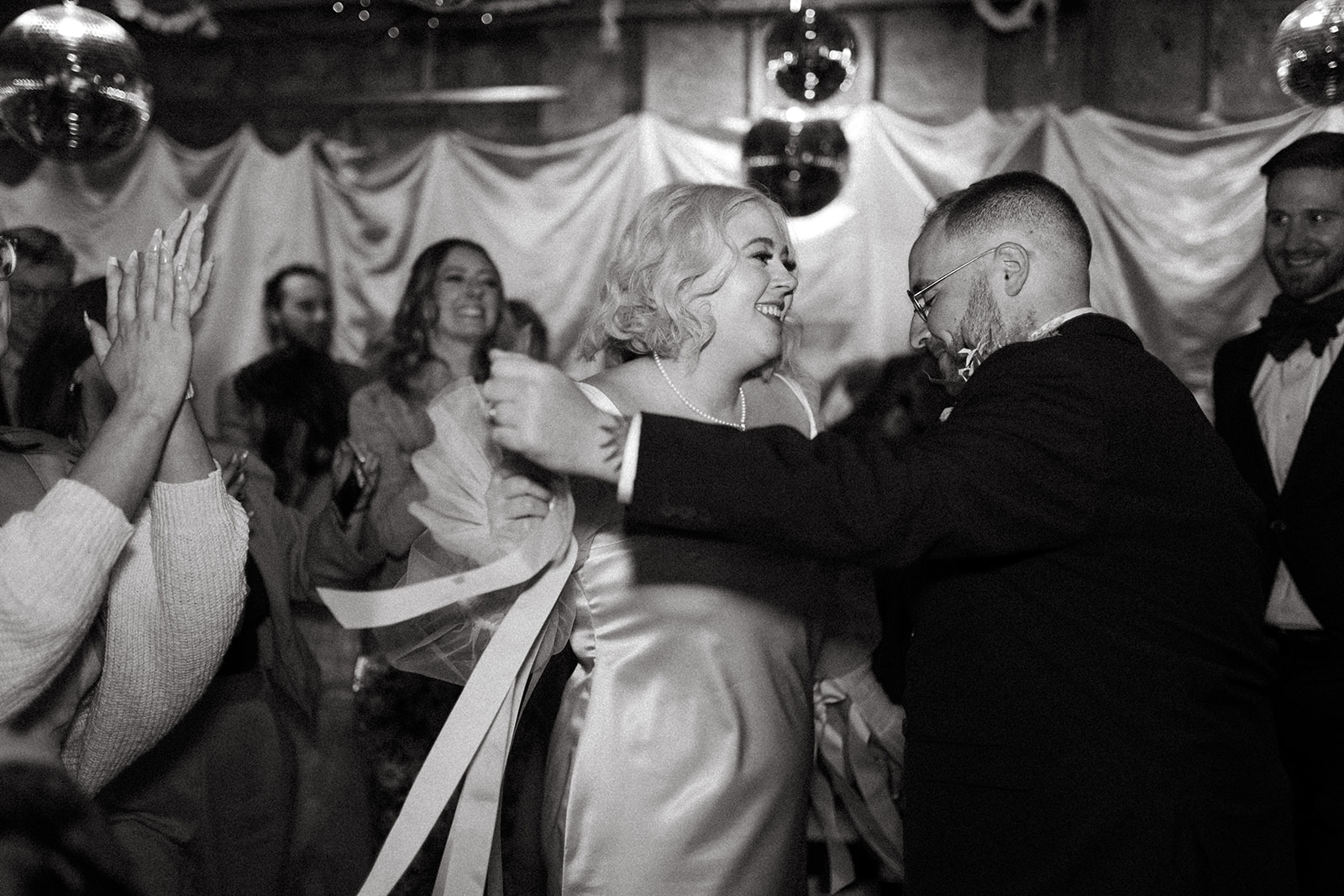 bride and groom dancing in disco wedding garage