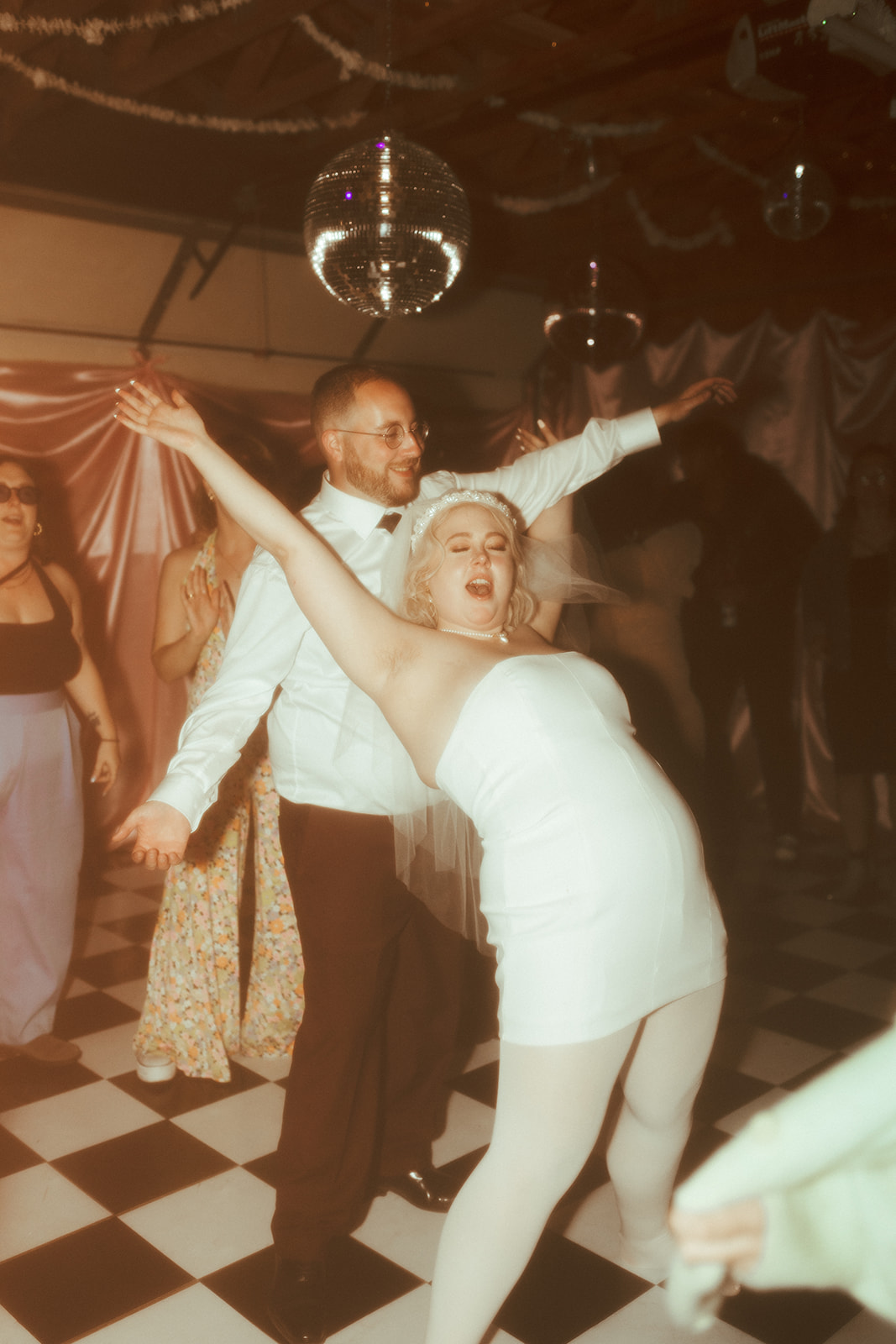 bride and groom disco dancing wedding photo
