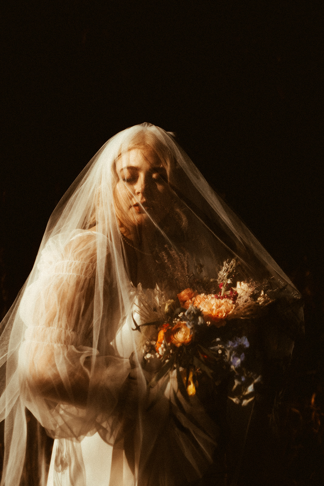 bride under veil wedding photo