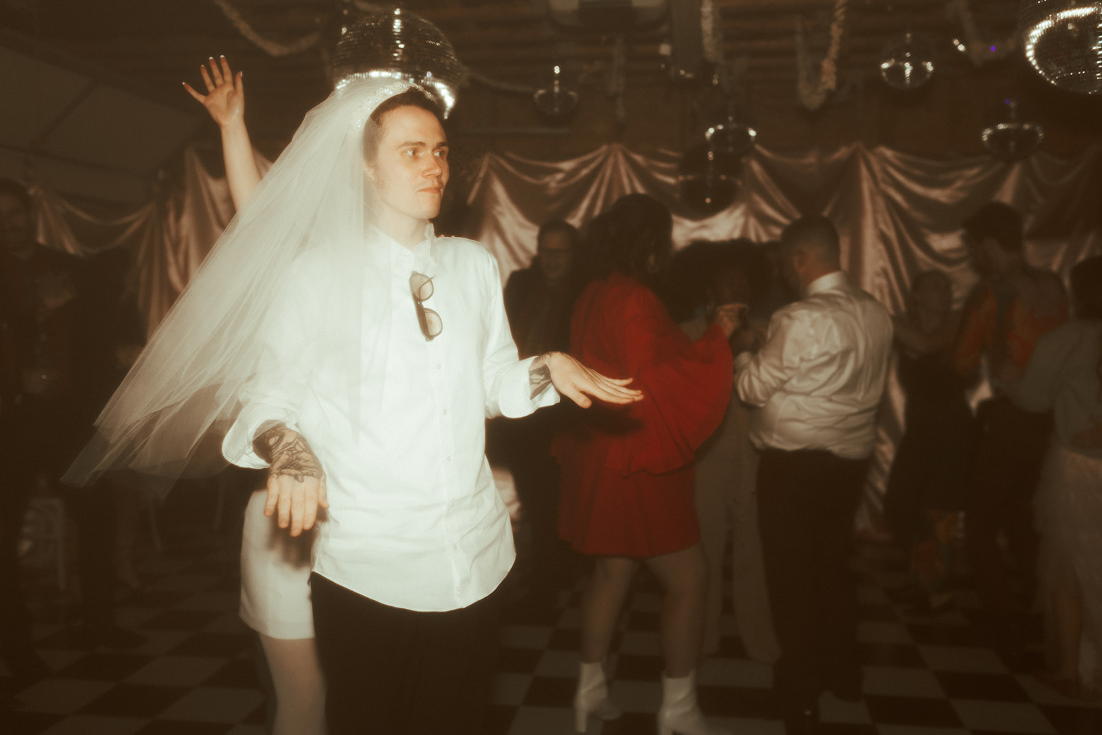 guy with brides veil on in funny wedding photo