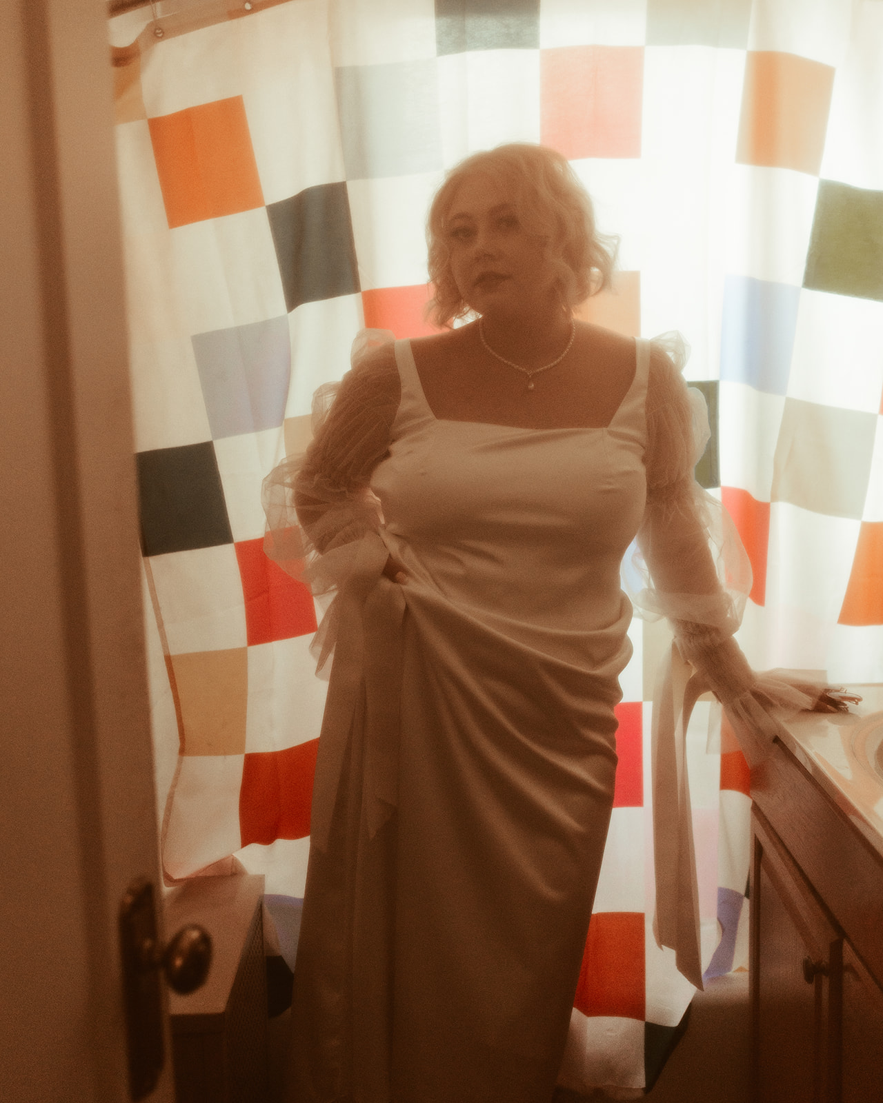 retro bride in checkerboard bathroom