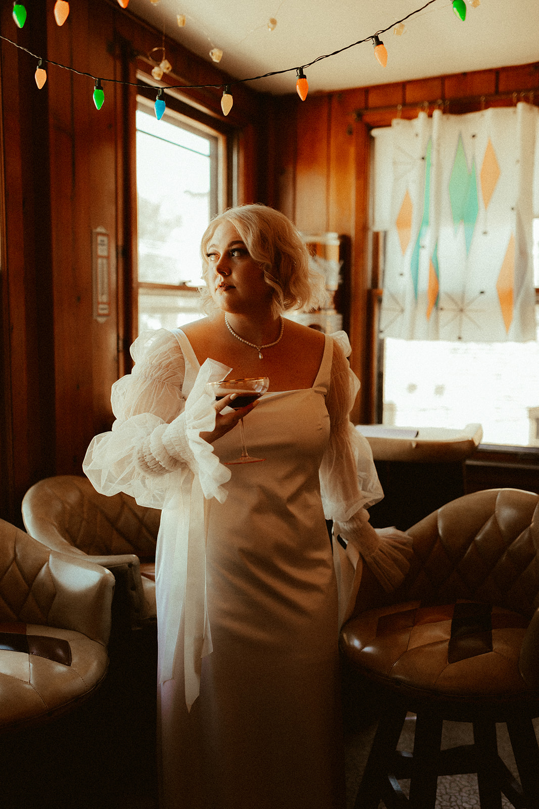 retro bride holding cocktail