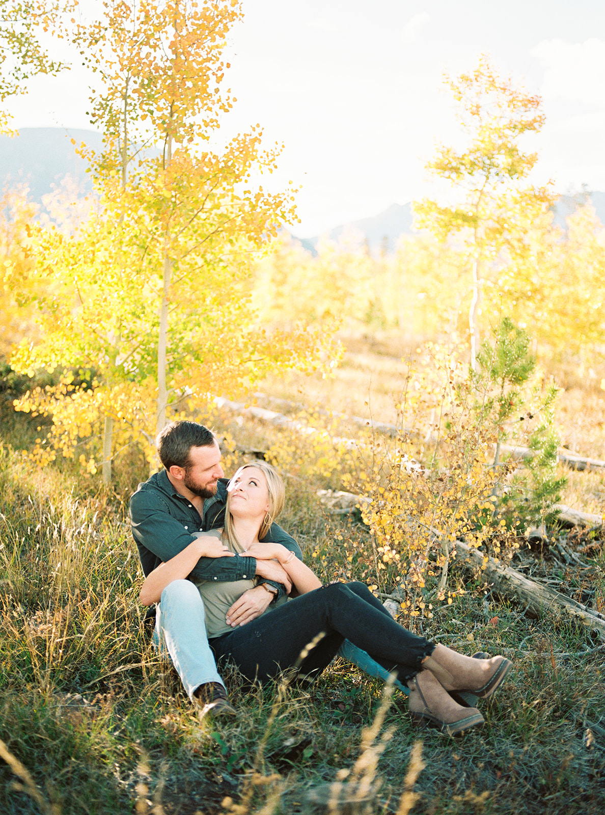Film engagement photo of couple in fall color mountain setting