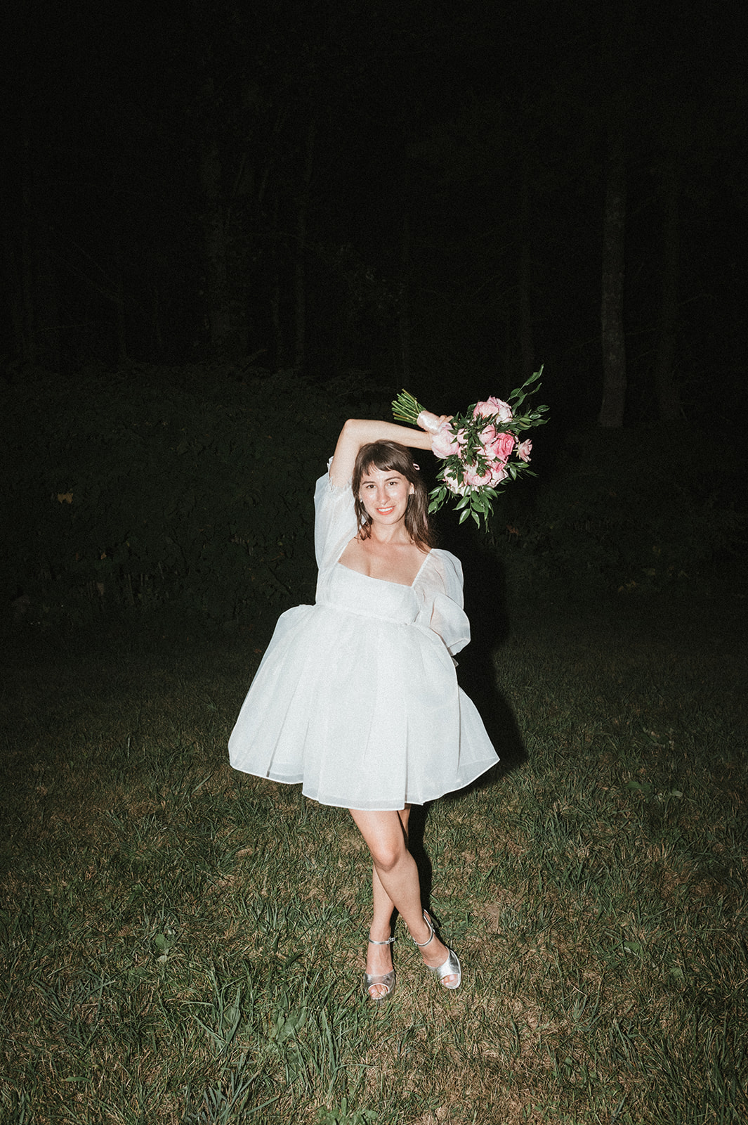 Bride poses with bouquet in Selkie dress at Kitz Farm New Hampshire Wedding