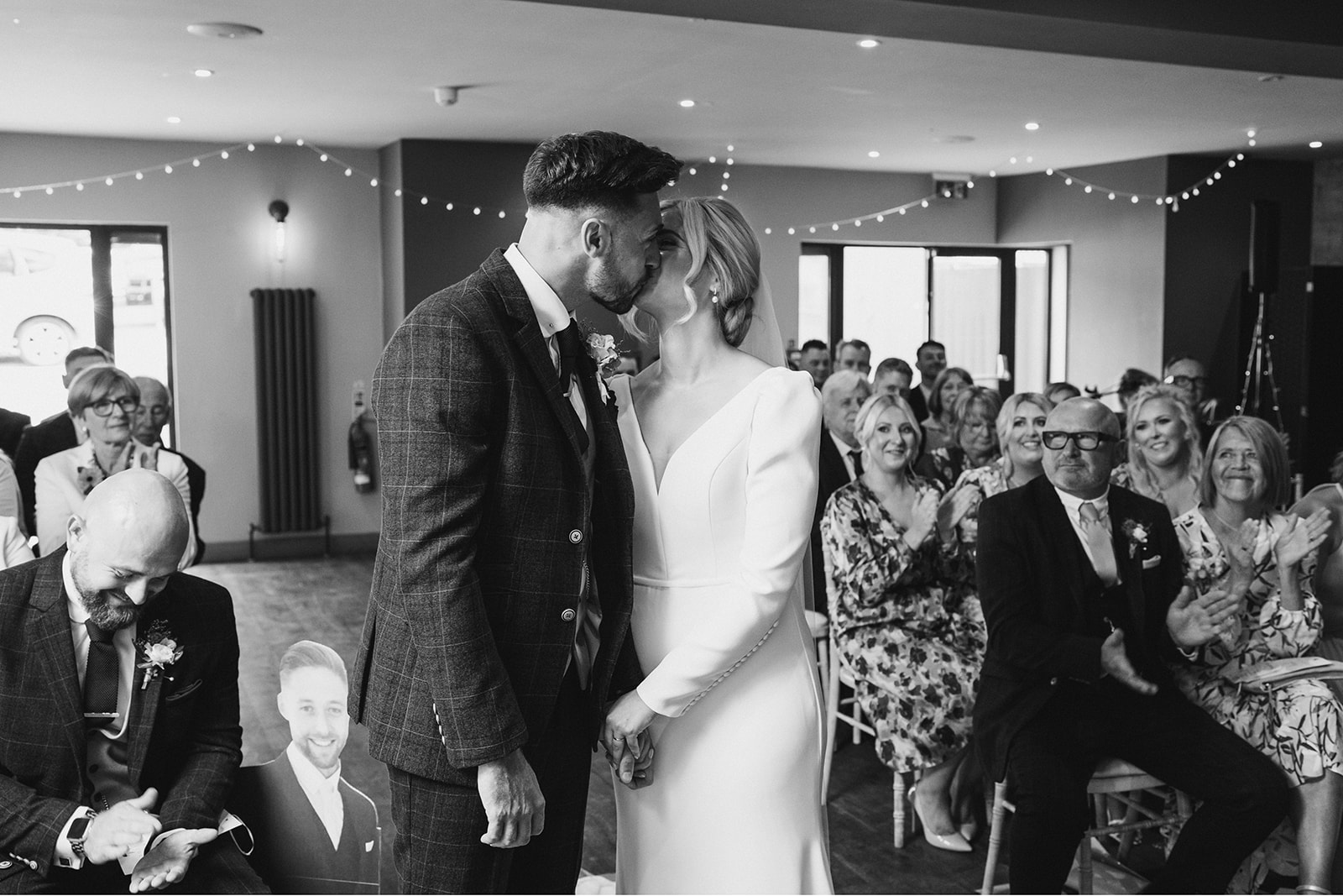 The Chequers Inn Wedding Photography - bride and grooms first kiss during the wedding ceremony