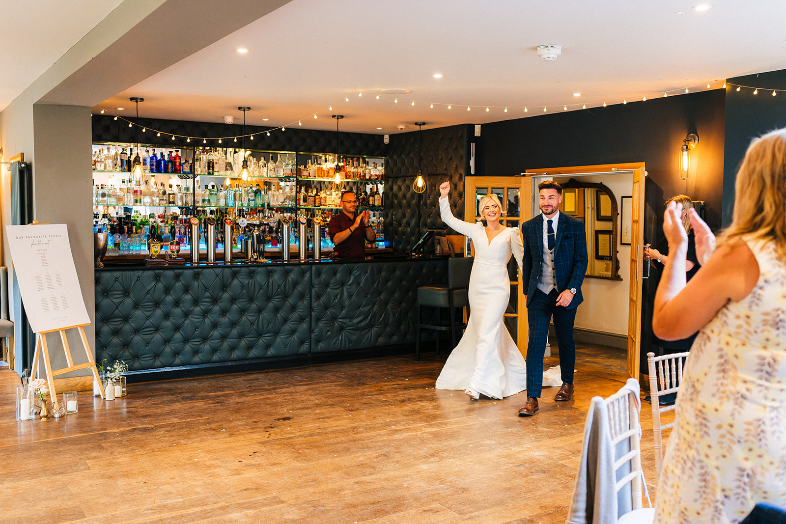 The Chequers Inn Wedding Photography - the bride and groom get announced into the wedding breakfast room