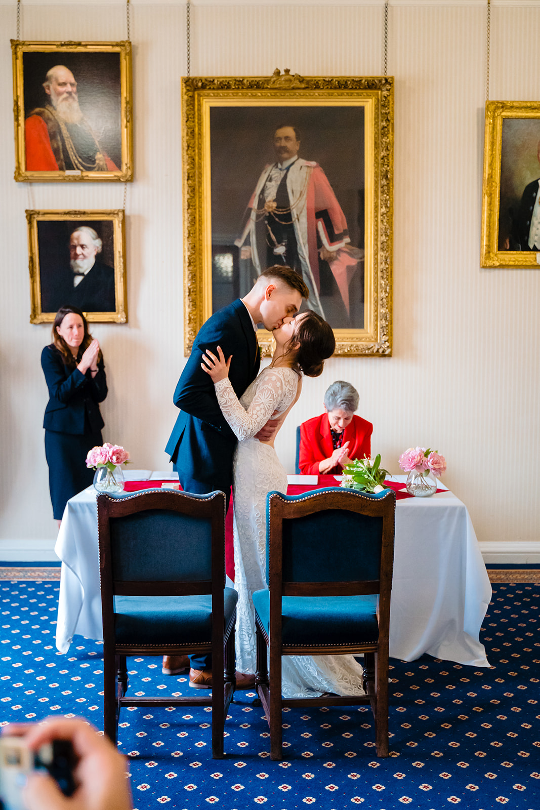 Husband and wife kiss after getting married in Leeds civic hall