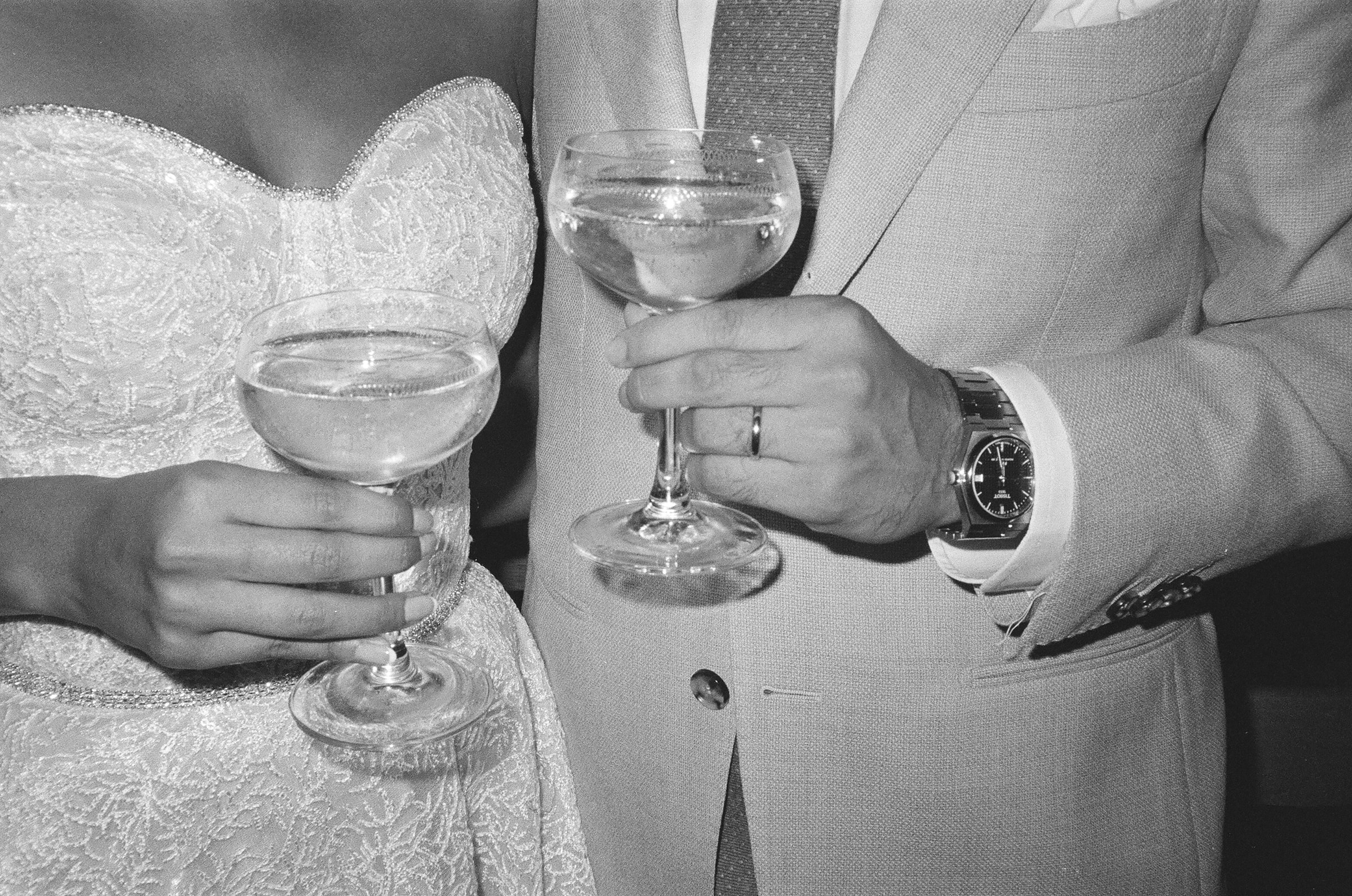 wedding couple who married at The Old Marylebone Town Hall enjoy champagne on 35mm film