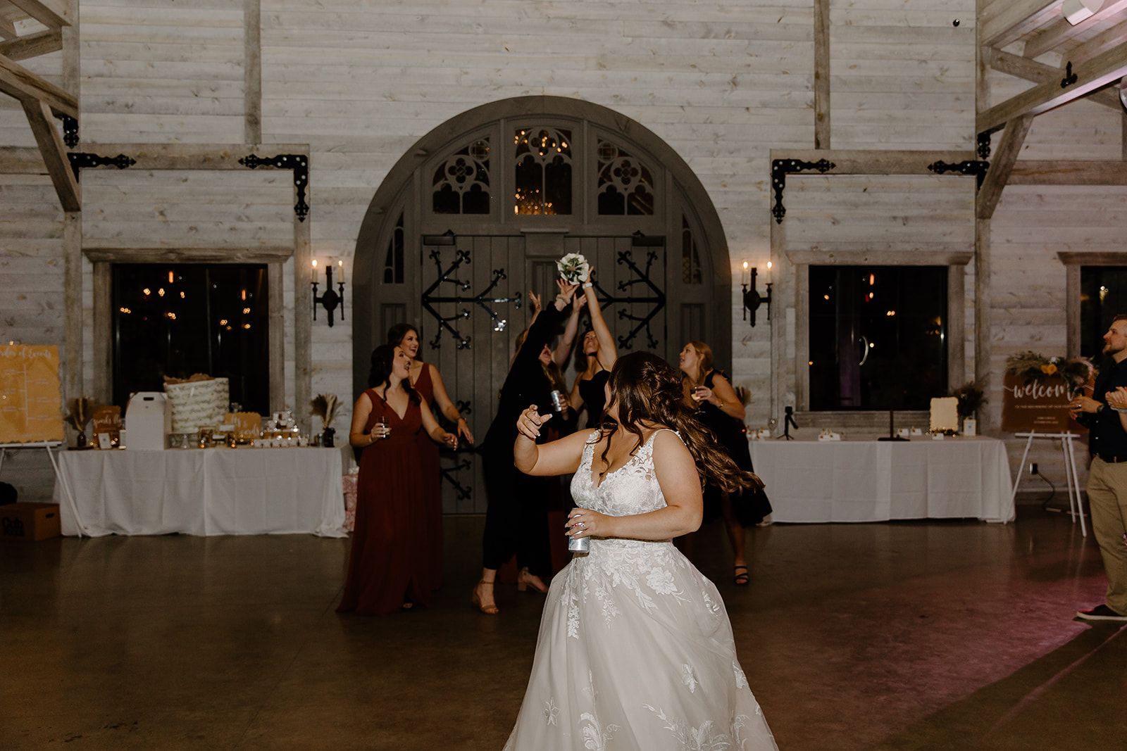 Bride throws bouquet to ladies