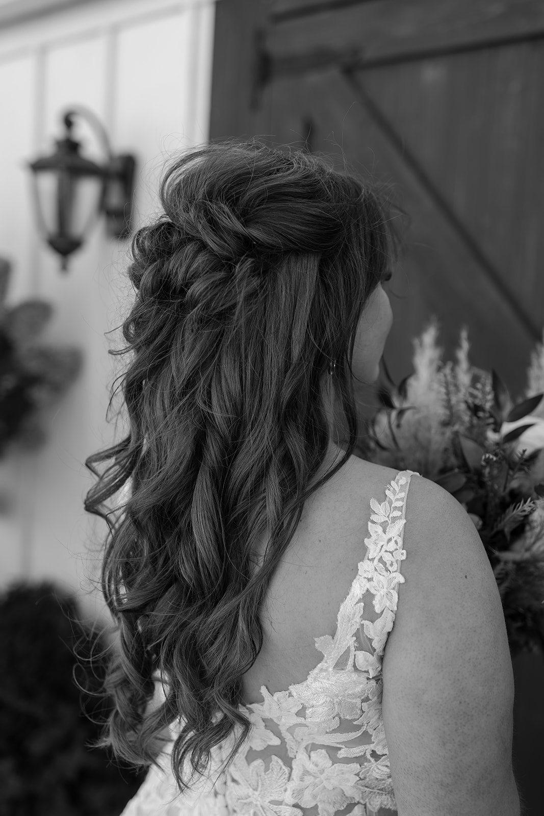 Bride's hair in front of a barn door