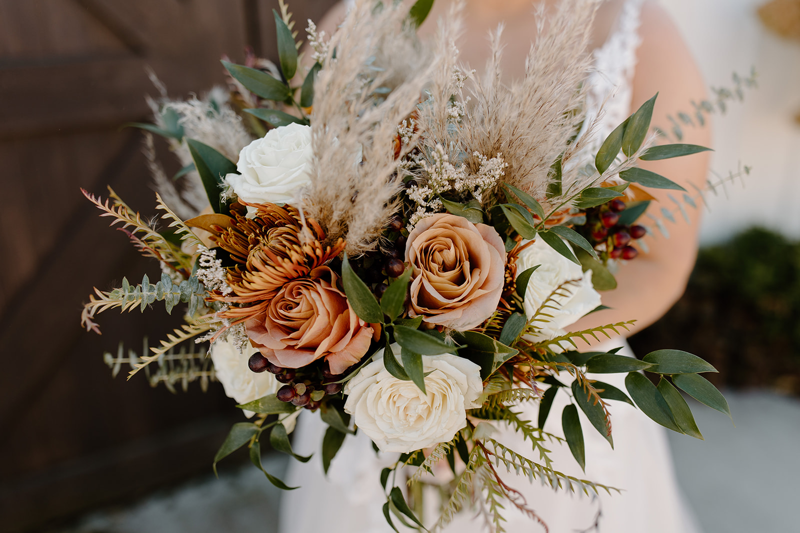 Bridal bouquet with roses and pampas grass