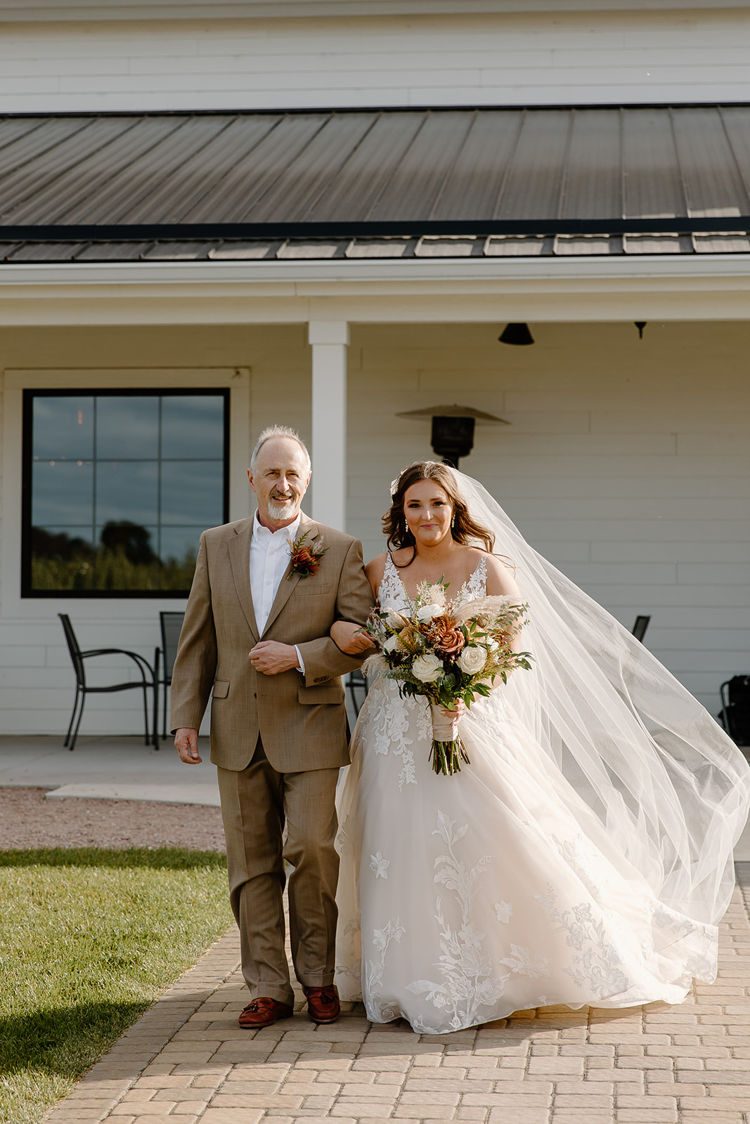 Bride and her father walk down the aisle