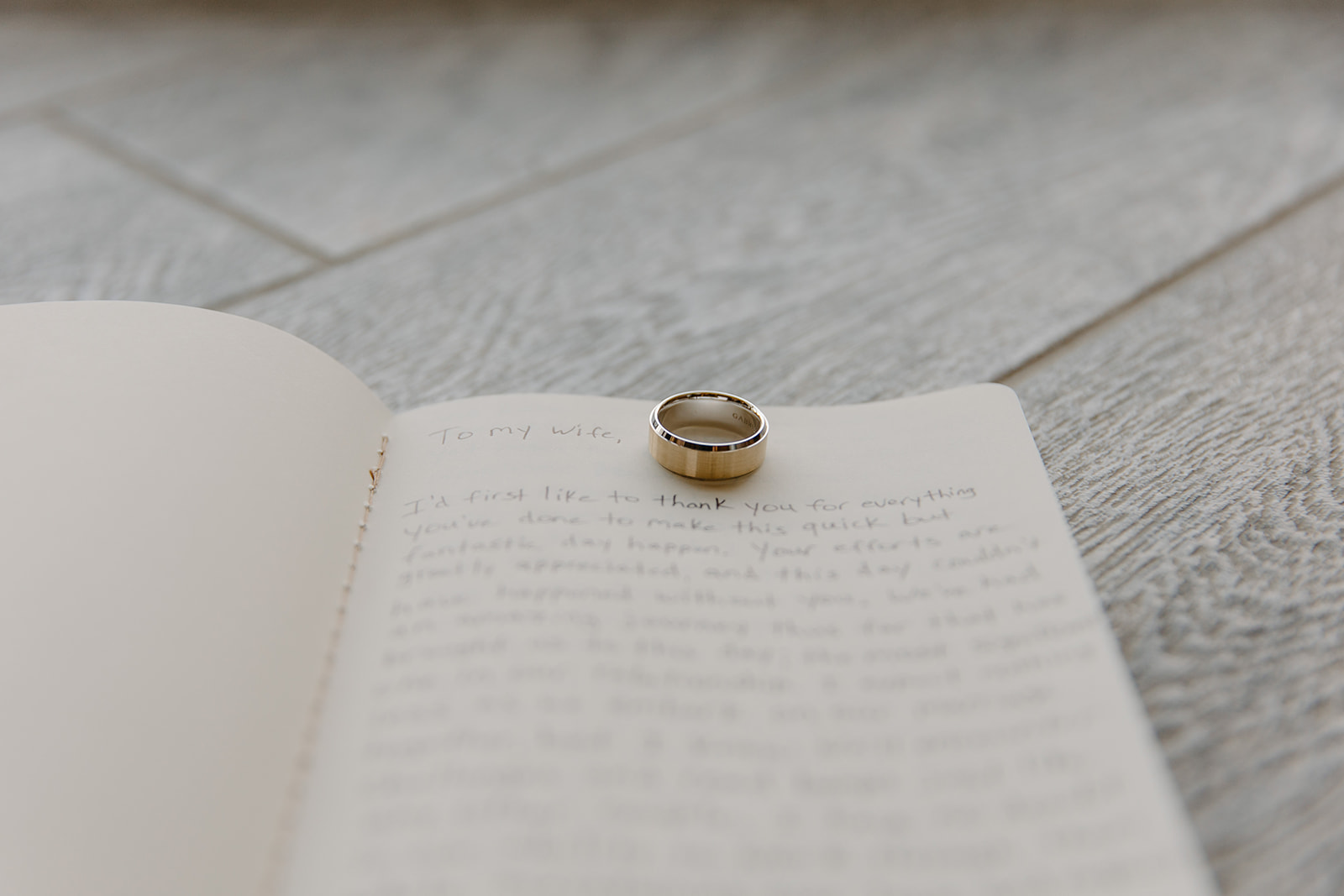 Wedding ring on vow book