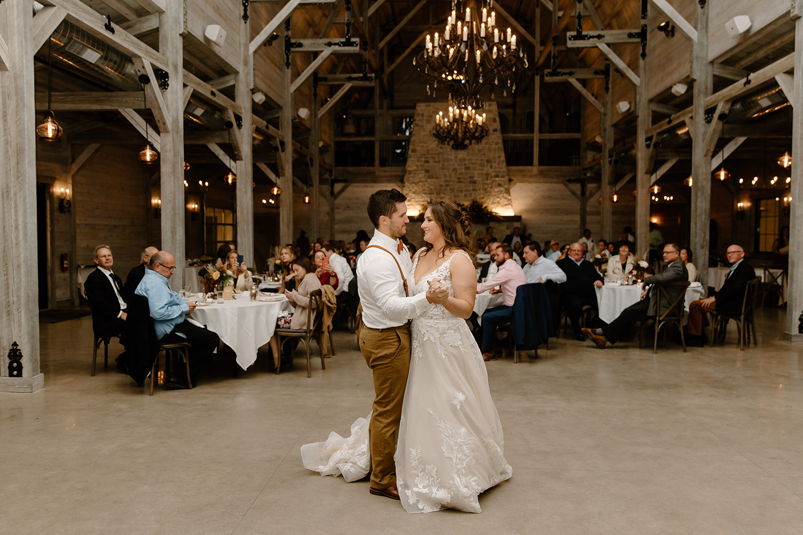Bride and groom dance in front of their guests