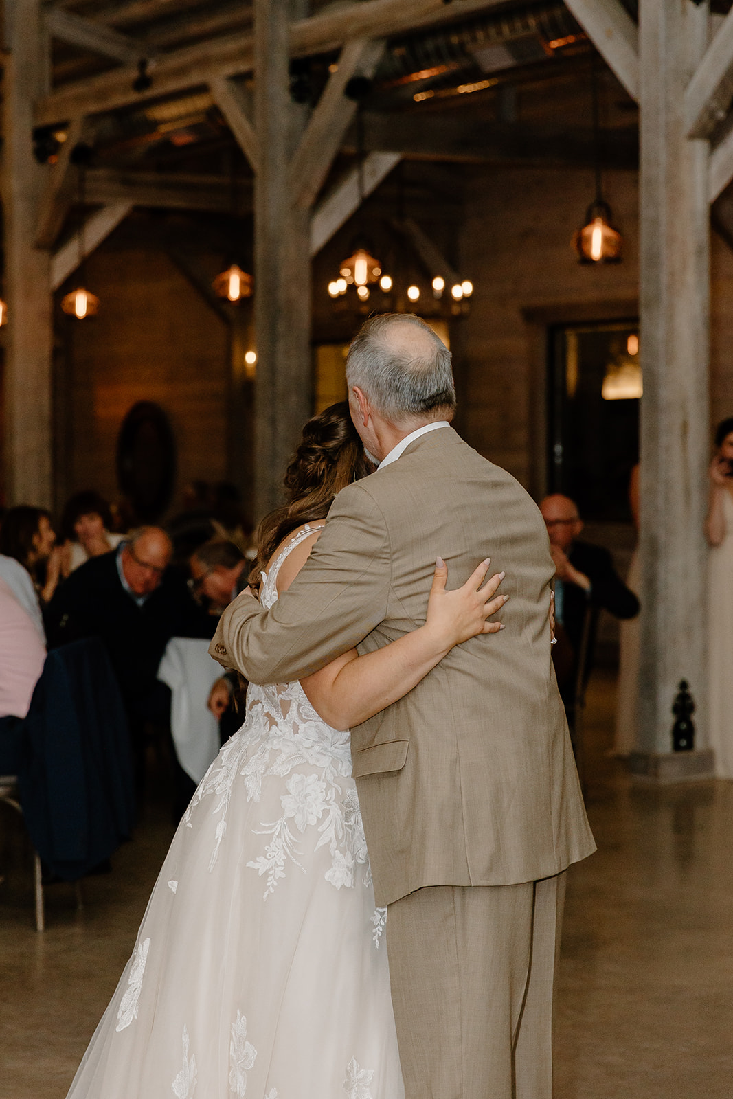 Bride and father hug on the dance floor