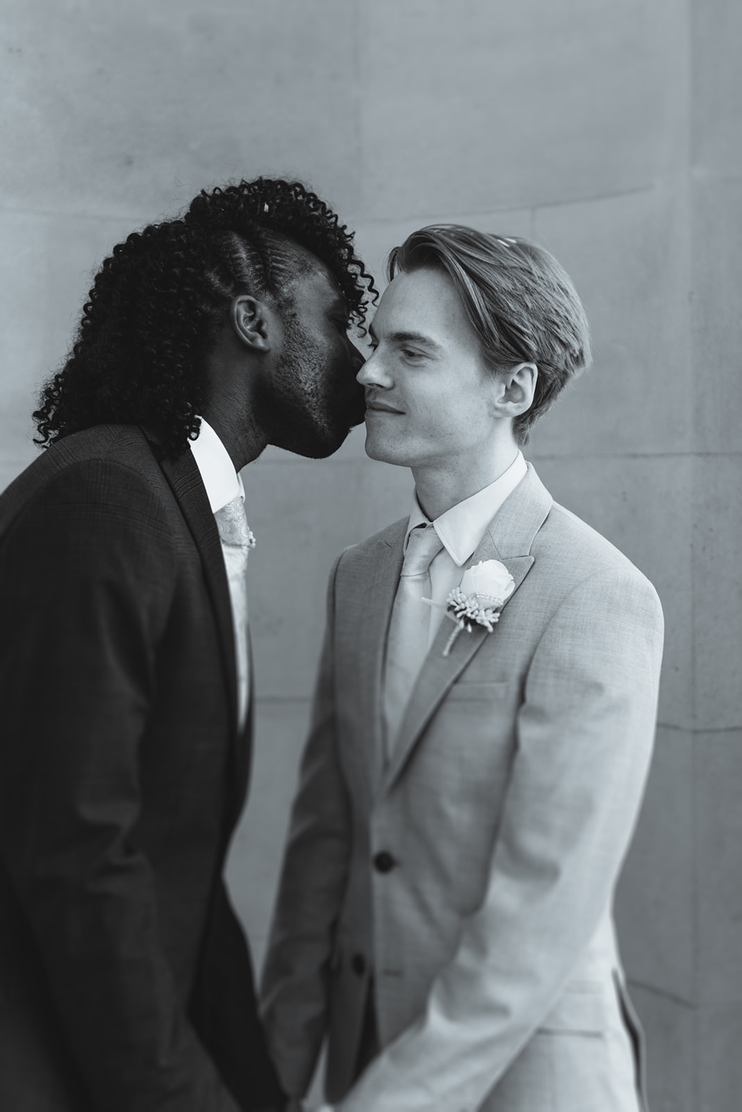 Romantic portrait of Benjamin and Ezekiel kissing at the Marylebone Town Hall