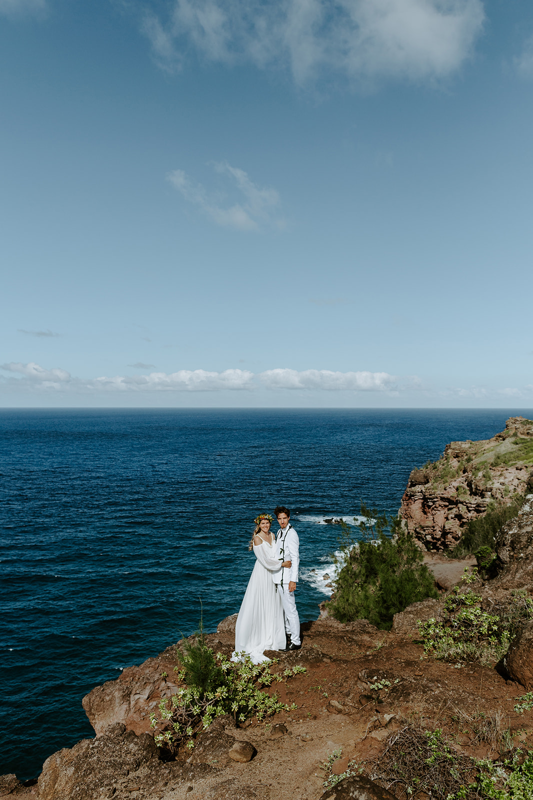 A couple who eloped in Maui say their vows during a Hawaii cliffside wedding ceremony by the ocean 