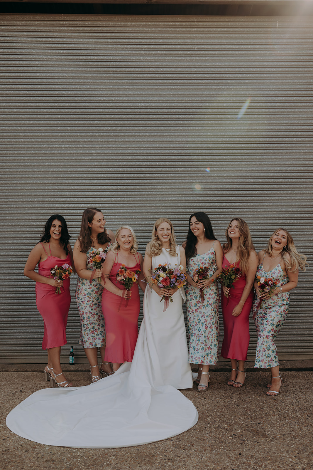 bridesmaids in mismatched hot pink dresses