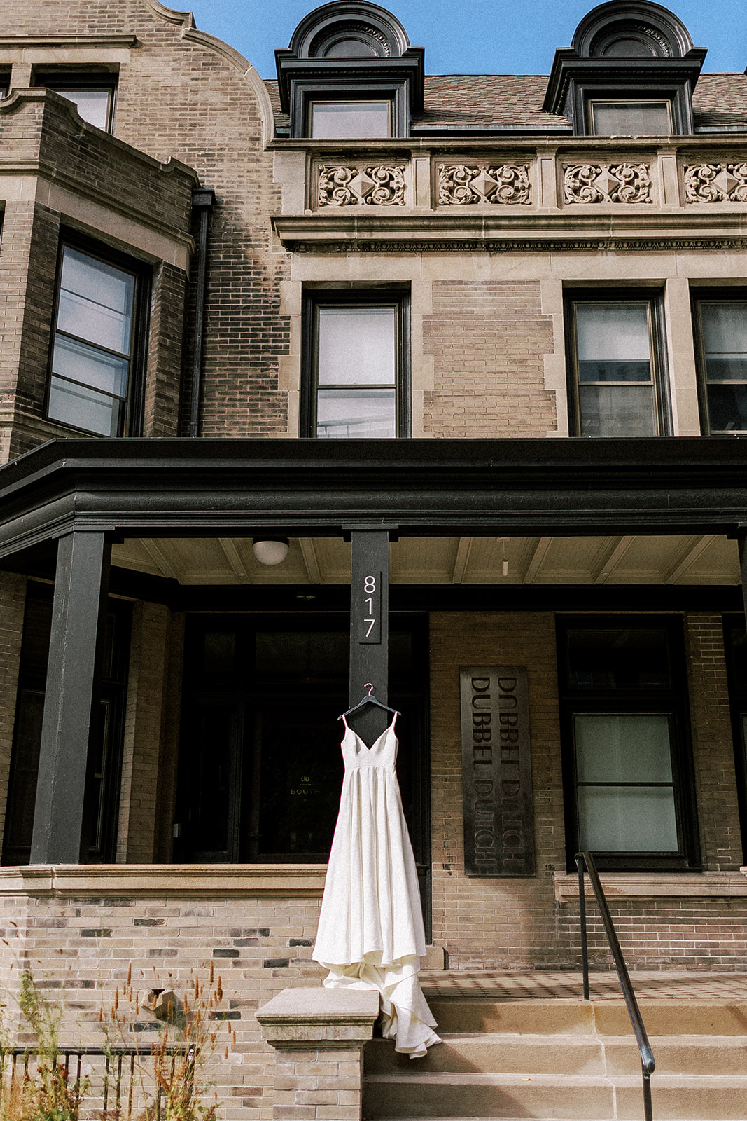 Wedding dress hangs outside of the Dubbel Dutch Hotel in downtown Milwaukeea