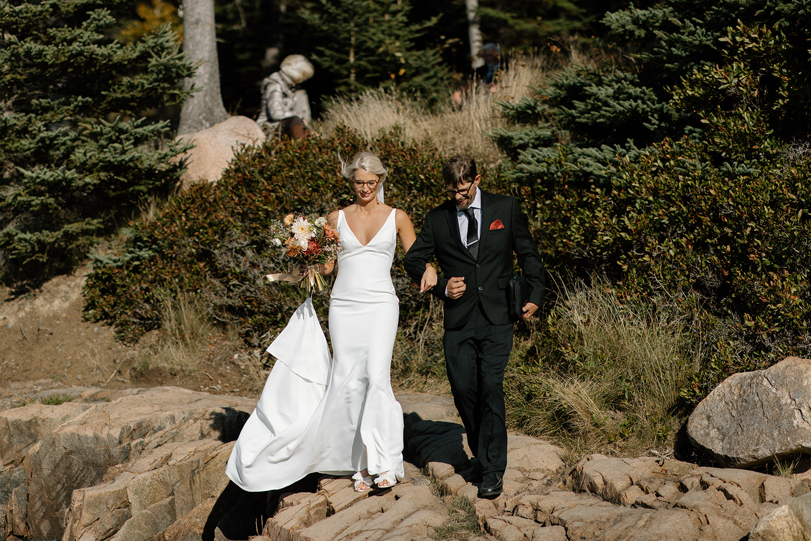 Intimate wedding ceremony at Otter Point in Acadia National Park. Otter Point elopement with family in the fall.