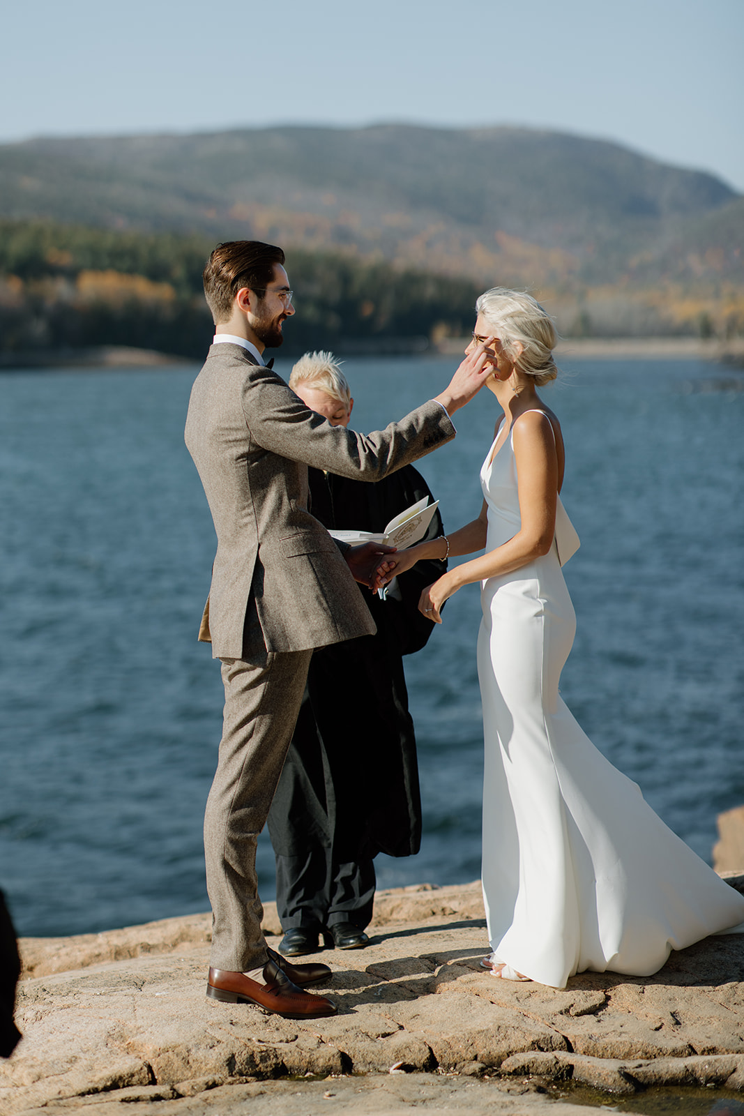 Intimate wedding ceremony at Otter Point in Acadia National Park. Otter Point elopement with family in the fall.