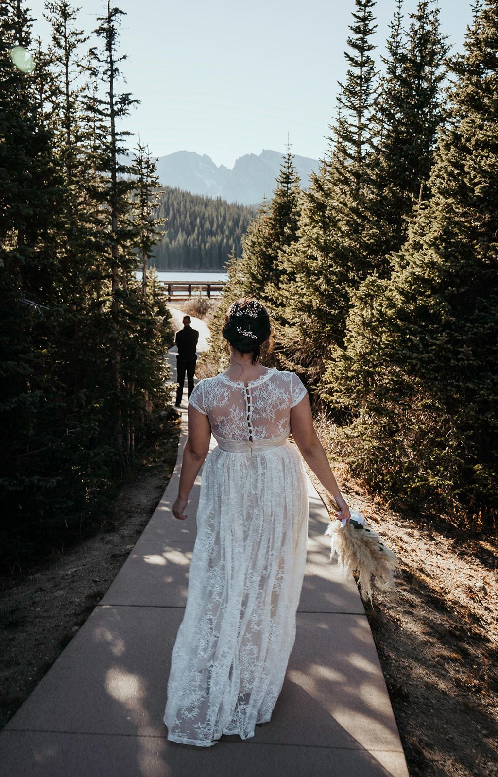 Bride walking down for first look with groom in a Colorado high mountain elopement