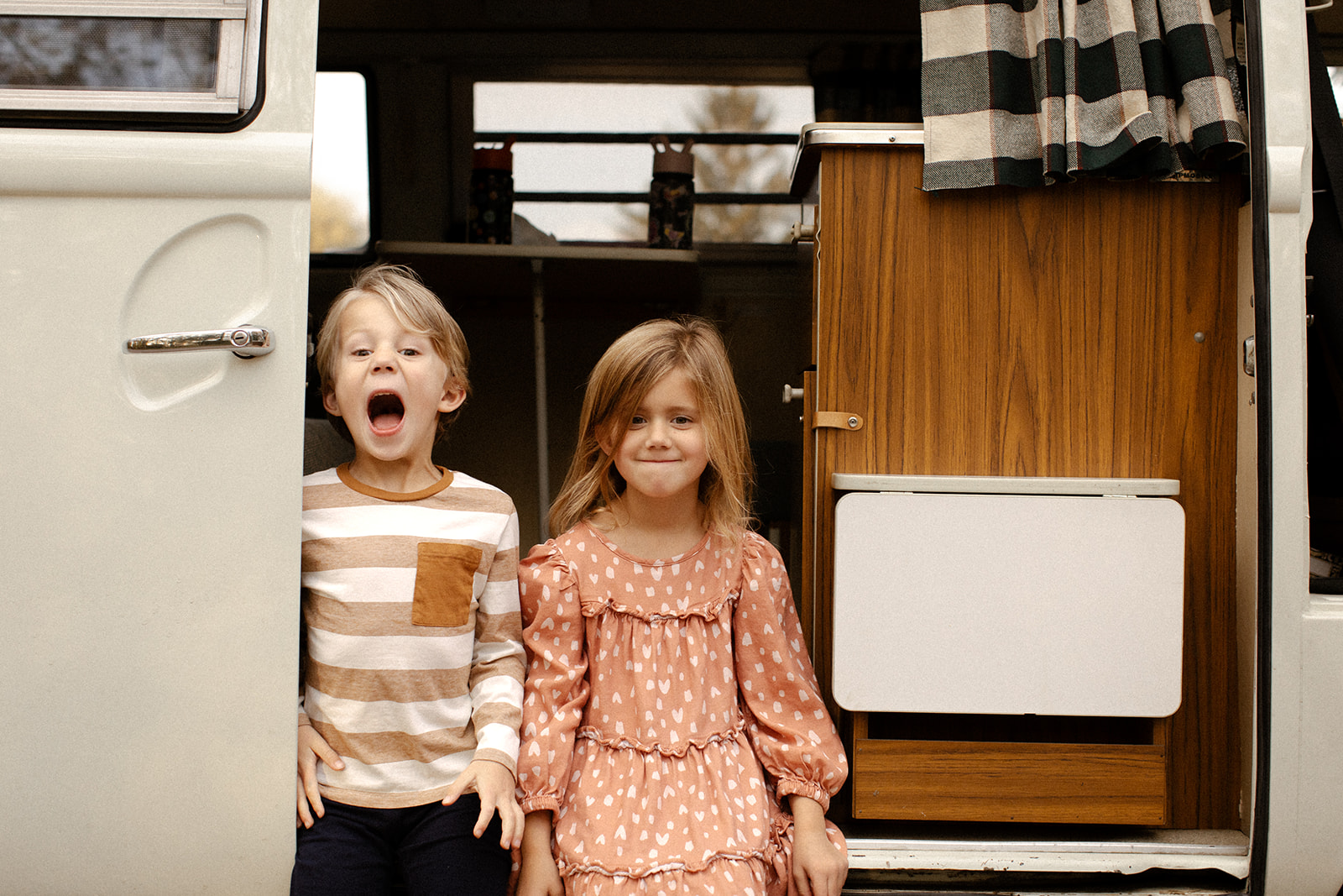Cute kiddos in a VW bus