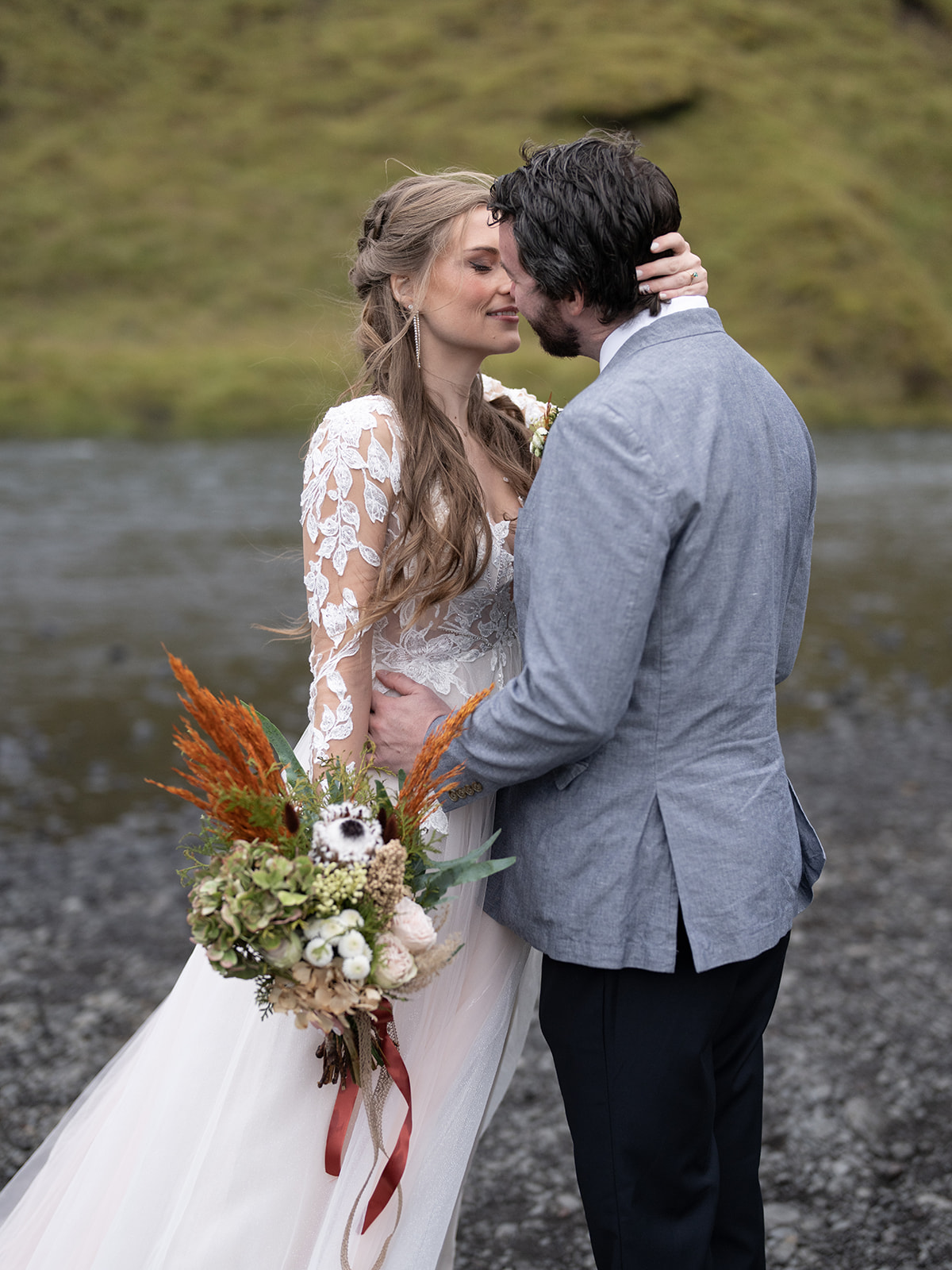 Bride and groom eloping in Iceland at skogafoss waterfall