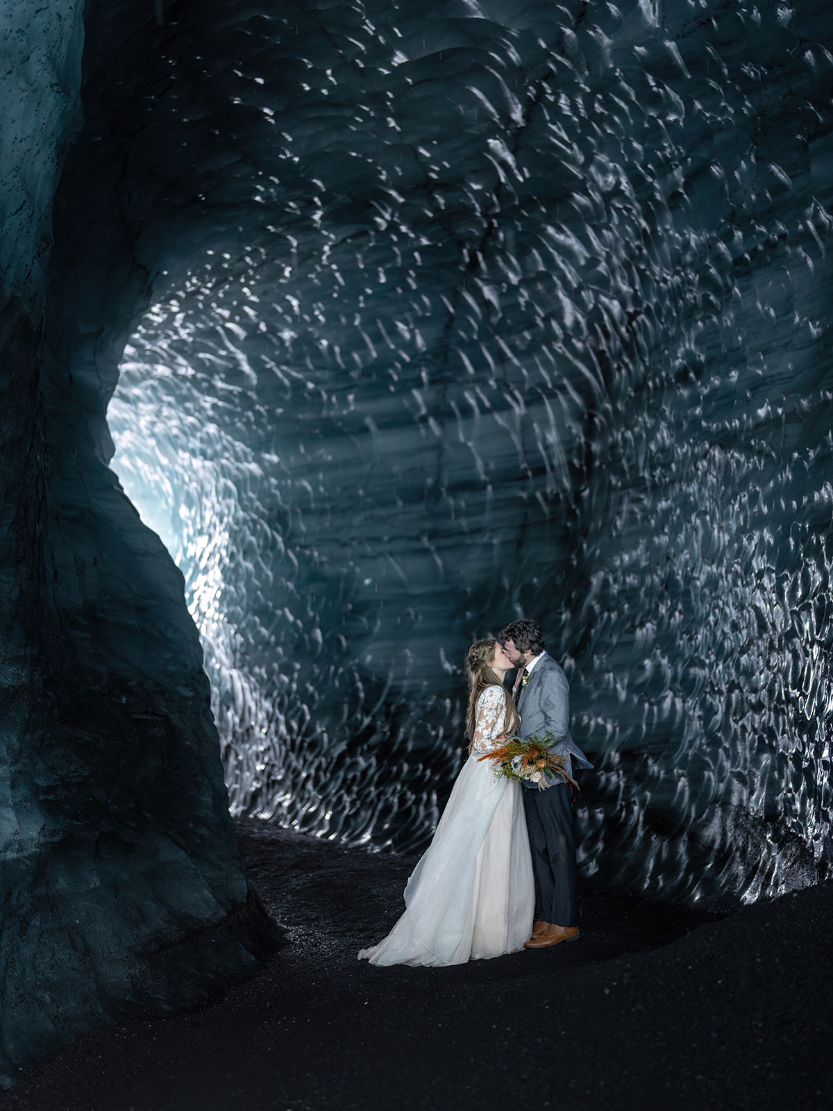 Bride and Groom taking their pictures in Catla Ice cave during their Elopement