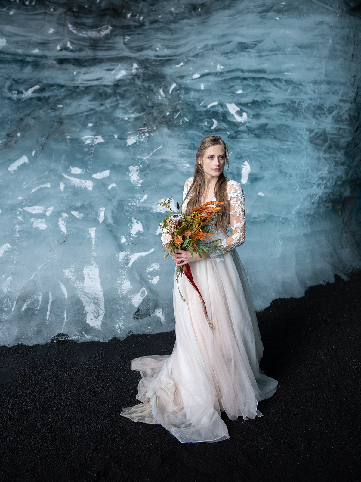 Bride and Groom taking their pictures in Catla Ice cave during their Elopement