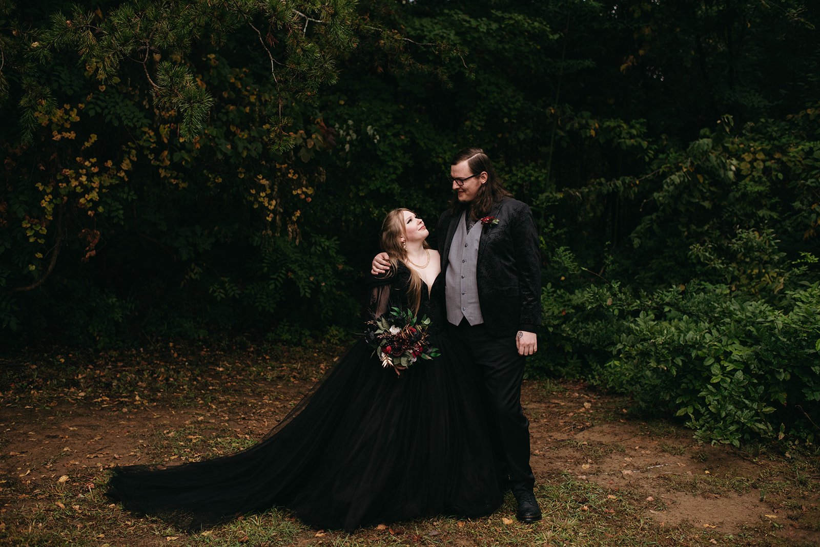 A rainy, gothic inspired wedding at Timberlake Earth Sanctuary in Whitsett North Carolina. 