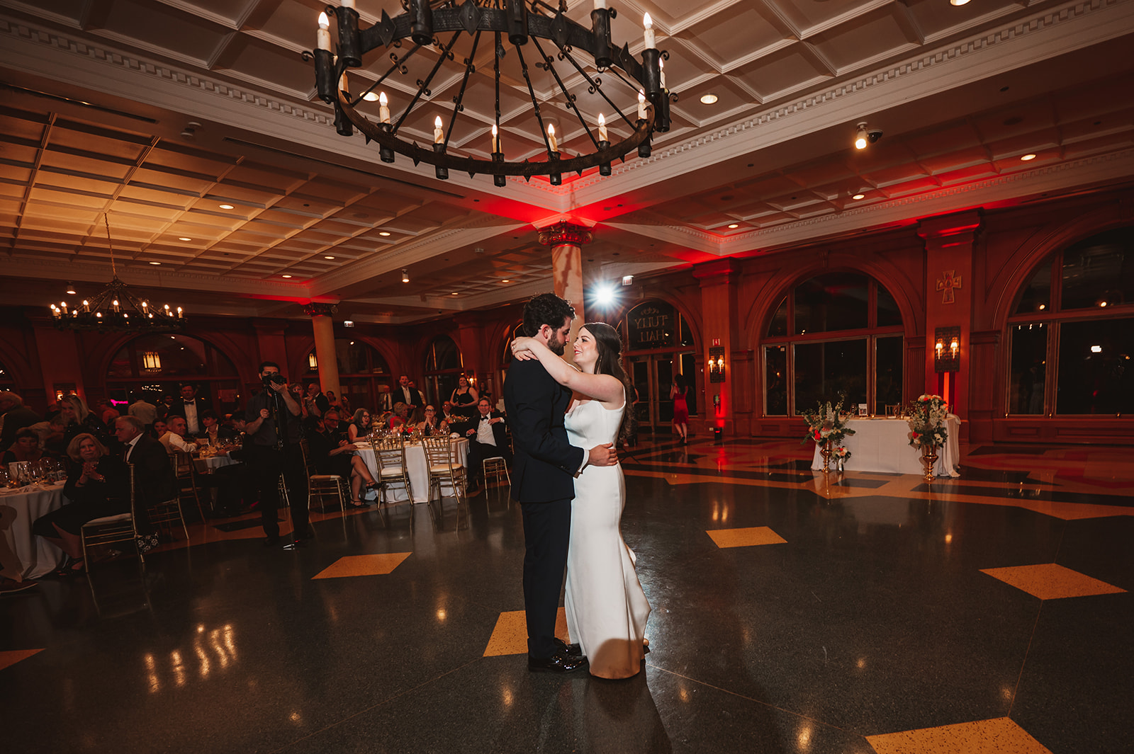 Photo of bride and groom's first dance in Saint Ignatius College, prep Chicago and the Tully Hall