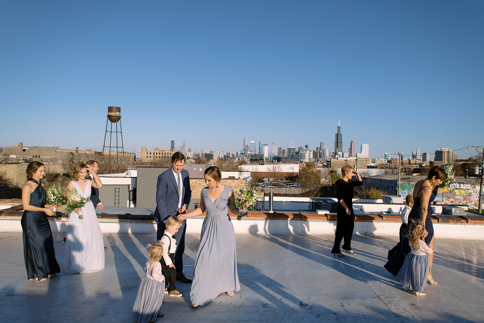 Family photos on rooftop of Walden Chicago with the Chicago skyline in the background