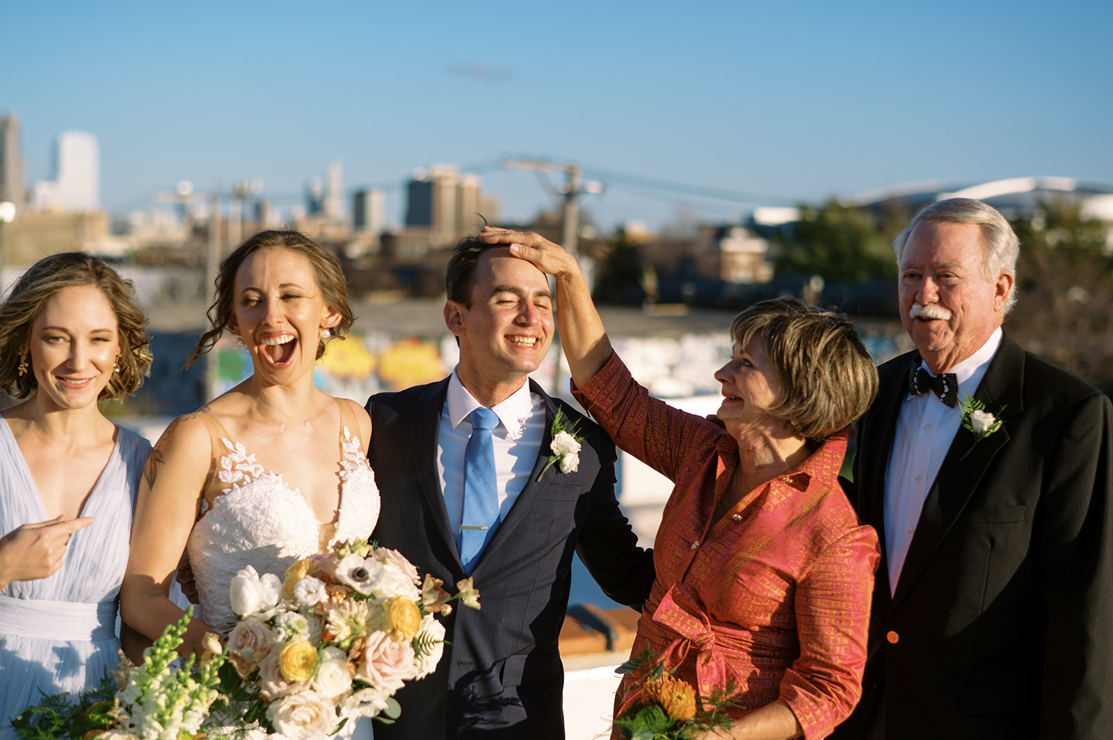 Family photos on rooftop of Walden Chicago with the Chicago skyline in the background