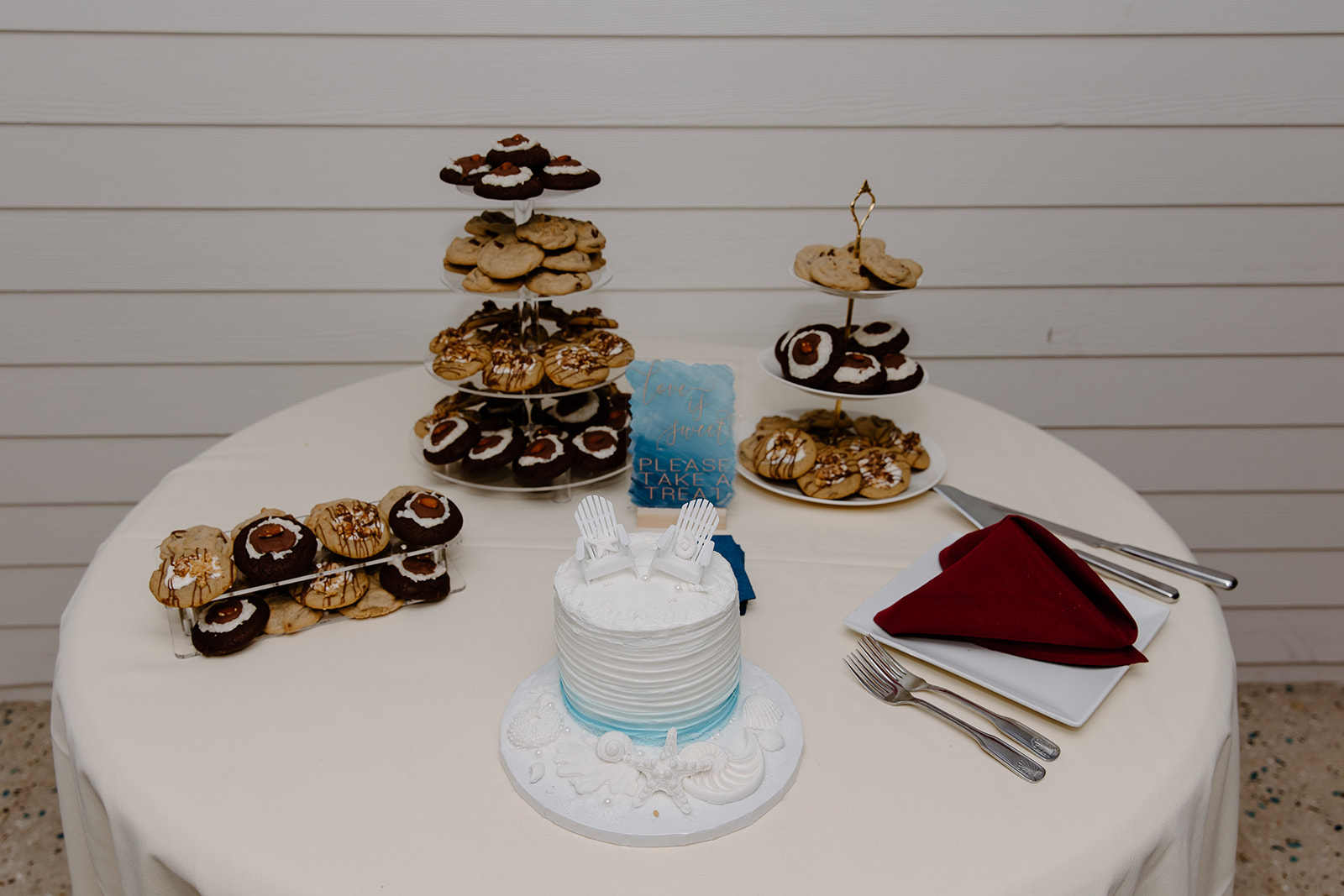 Table full of wedding cake and other desserts