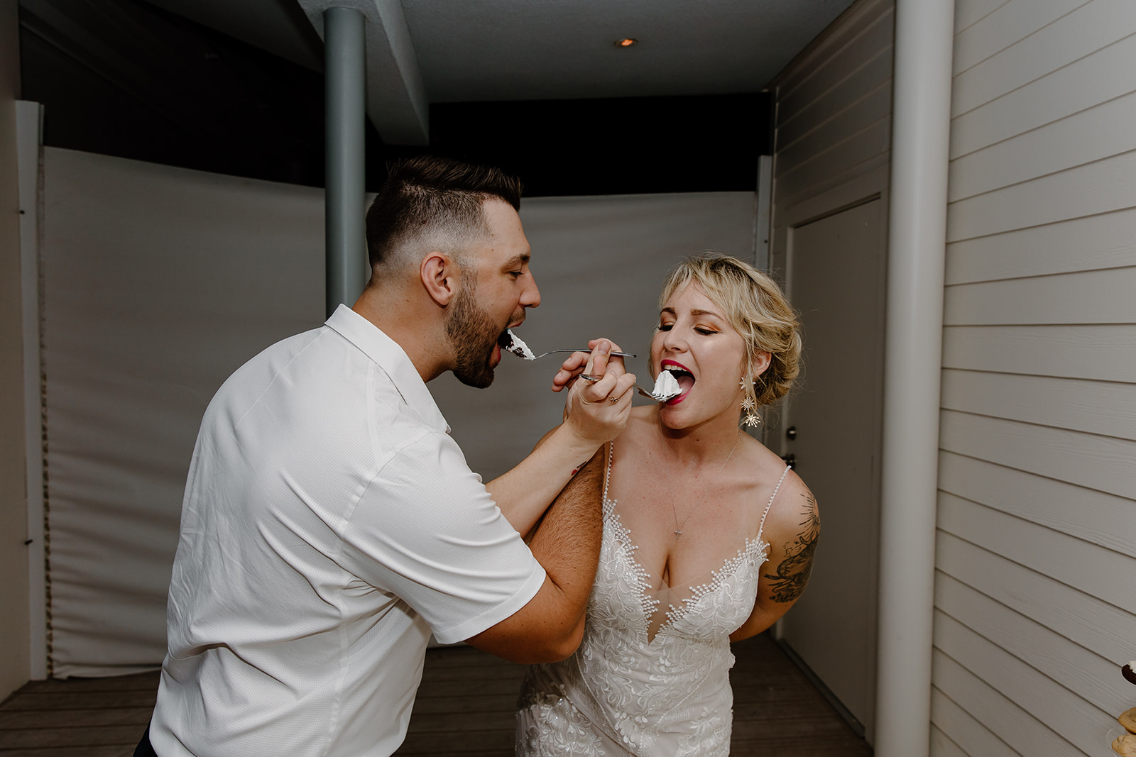 Bride and groom eat cake