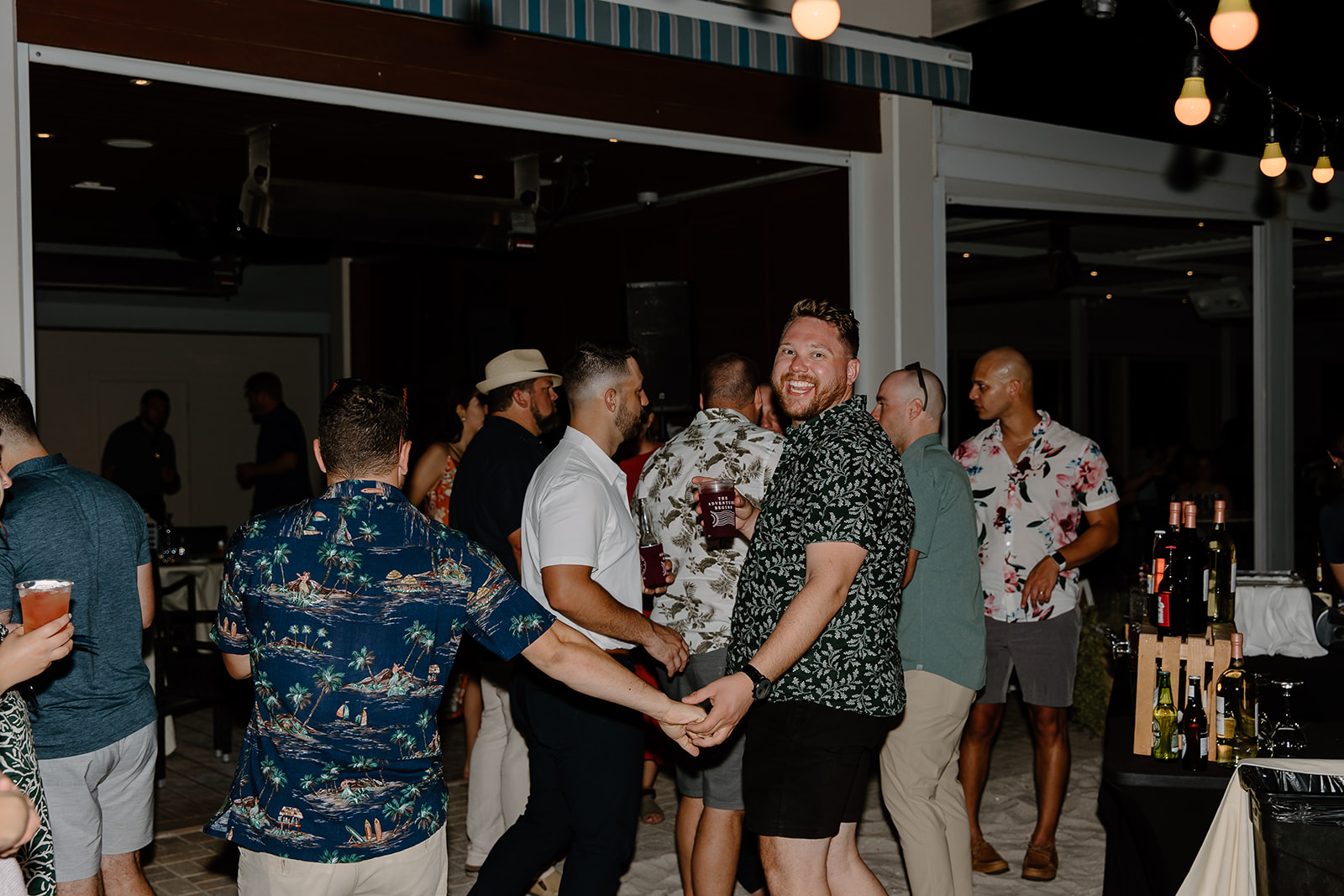 Guests dance on the beach