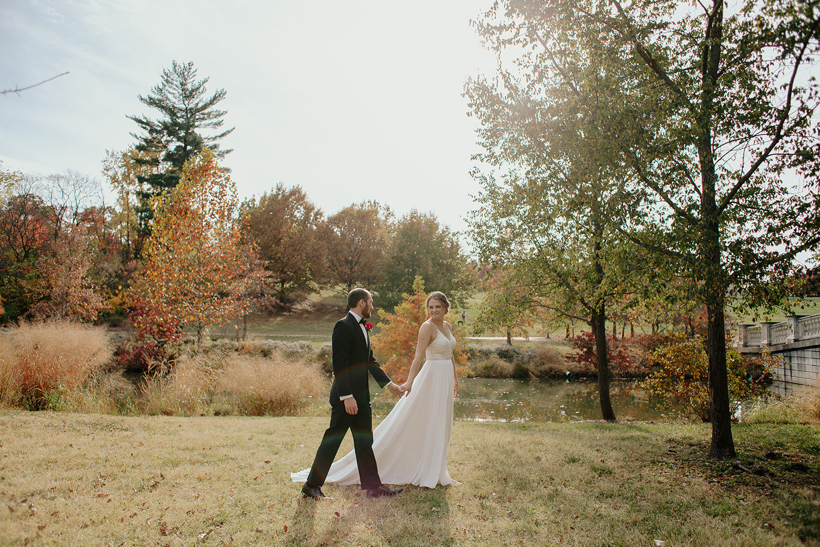 Newlyweds stroll through Forest Park St. Louis in the fall 
