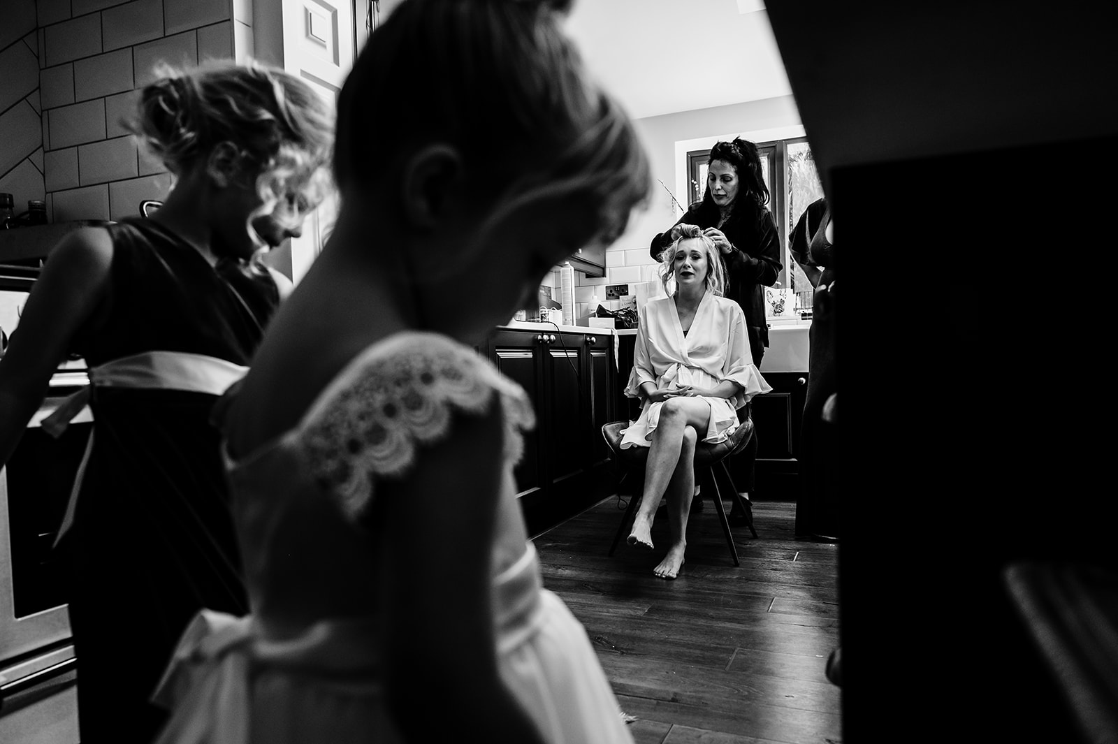 bride seeing her little girl in her flower girl dress for the first time