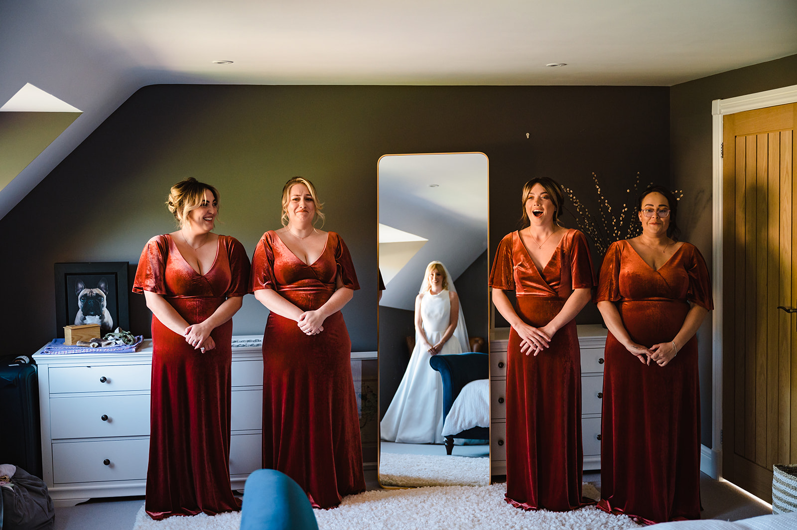 bridemaids in terracotta coloured dresses from ever pretty seeing bride for the first time in her dress