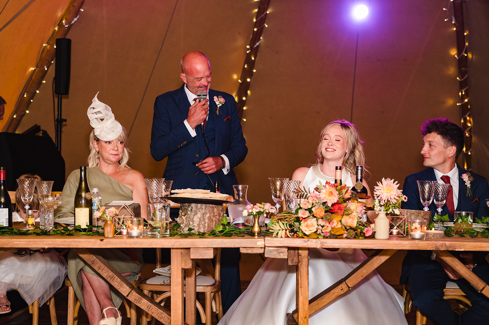 father of the bride giving a speech in autumn wedding in a tipi