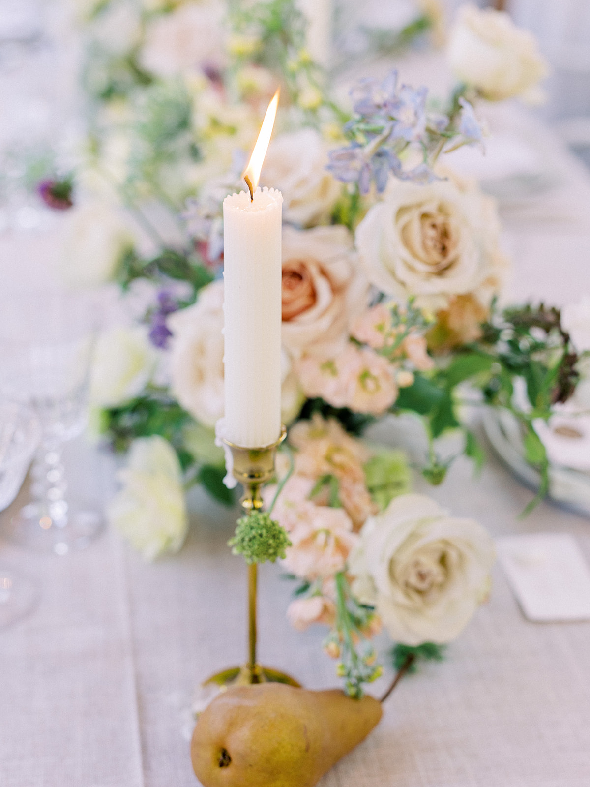 Gorgeous Scottsdale wedding reception table design complete with fresh florals, dripping candles & fruit
