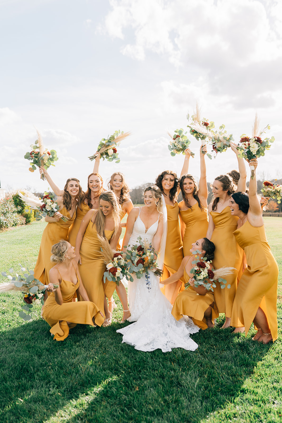 A bride and her bridesmaids cheer excitedly