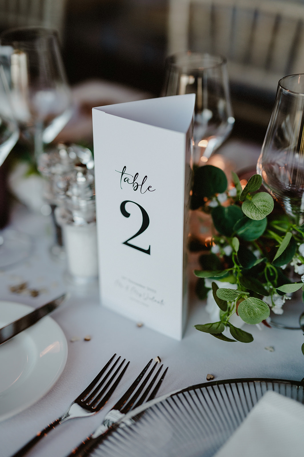 table number sign on a dressed table with florals at the wedding venue pentney abbey