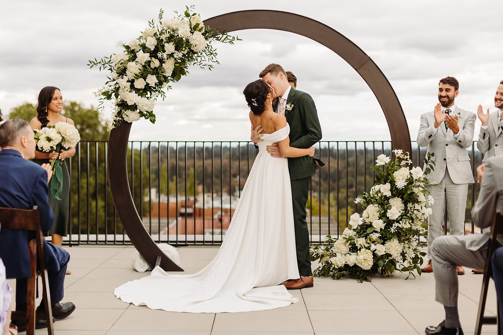 ceremony kiss photo at ironlight rooftop terrace wedding lake oswego oregon