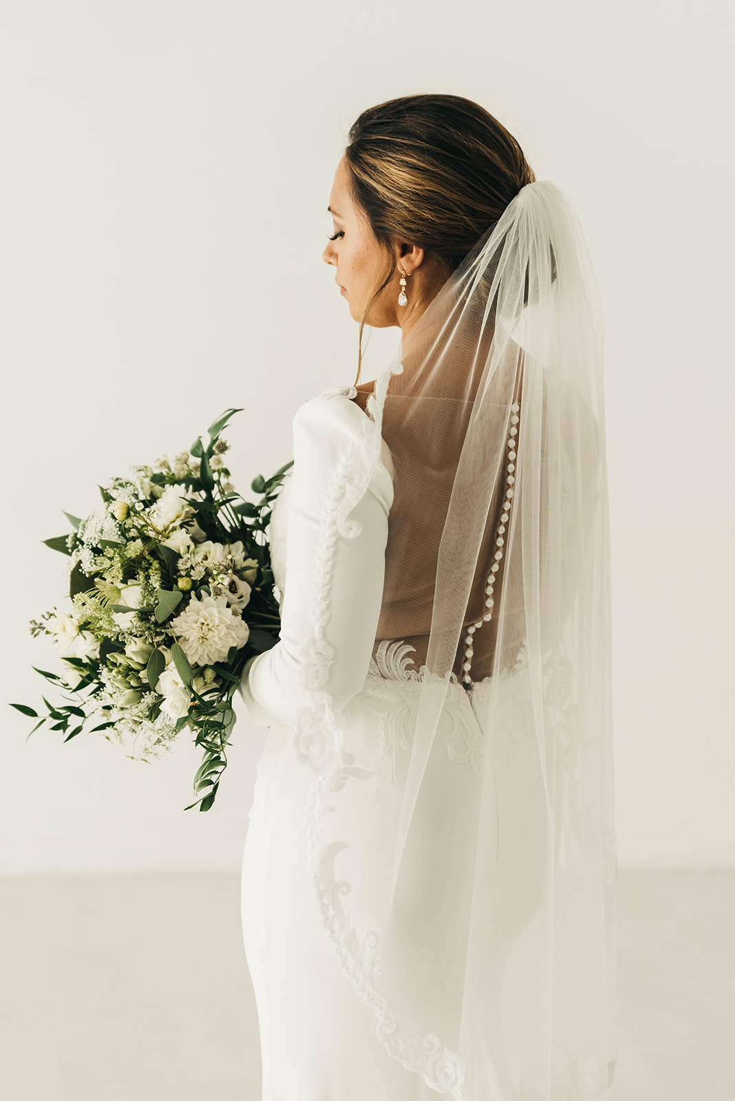 bride dress and a bouquet and veil