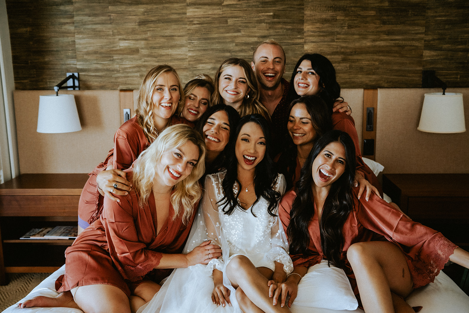 Bridal party gather in for a big hug with the bride during the getting ready
