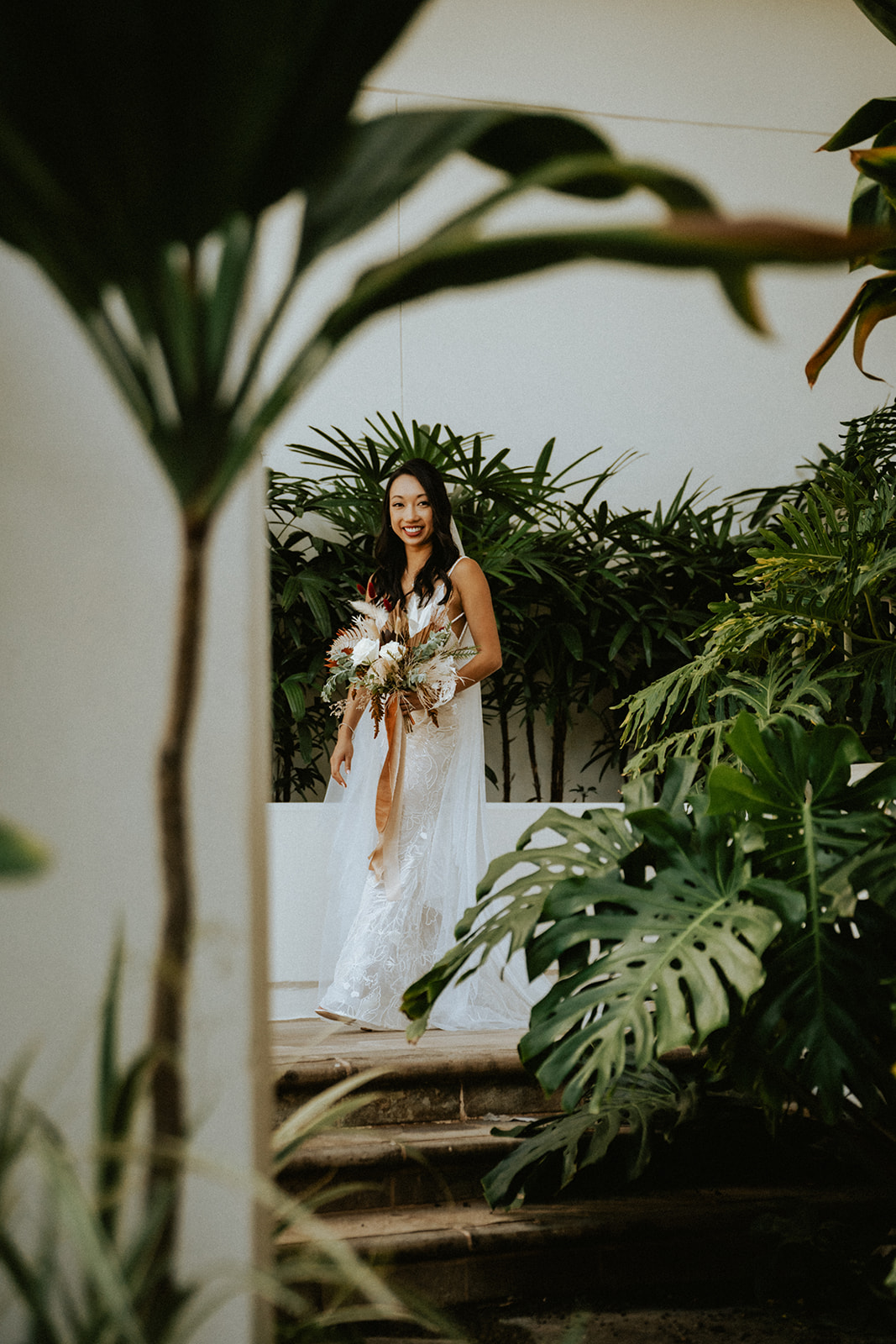 First Look with the bride and groom at the luxurious Four Seasons Resort Koi pond and Gardens