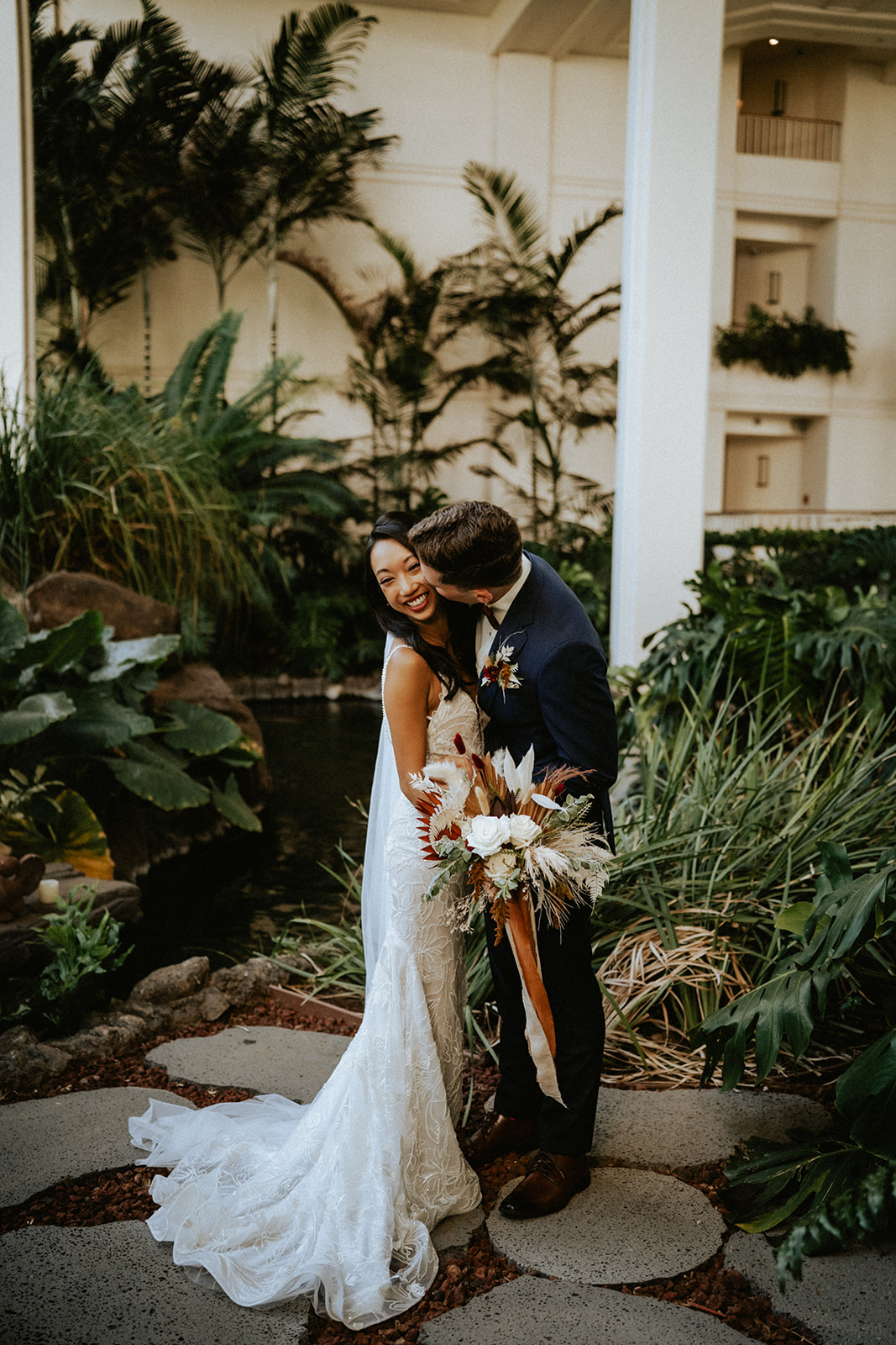 Bride and groom in the garden of Four Seasons Resort